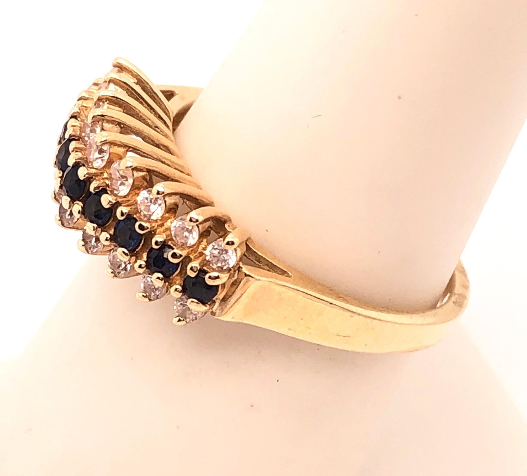 Women's 14 Karat Yellow Gold Contemporary Ring with Sapphire and Diamond For Sale