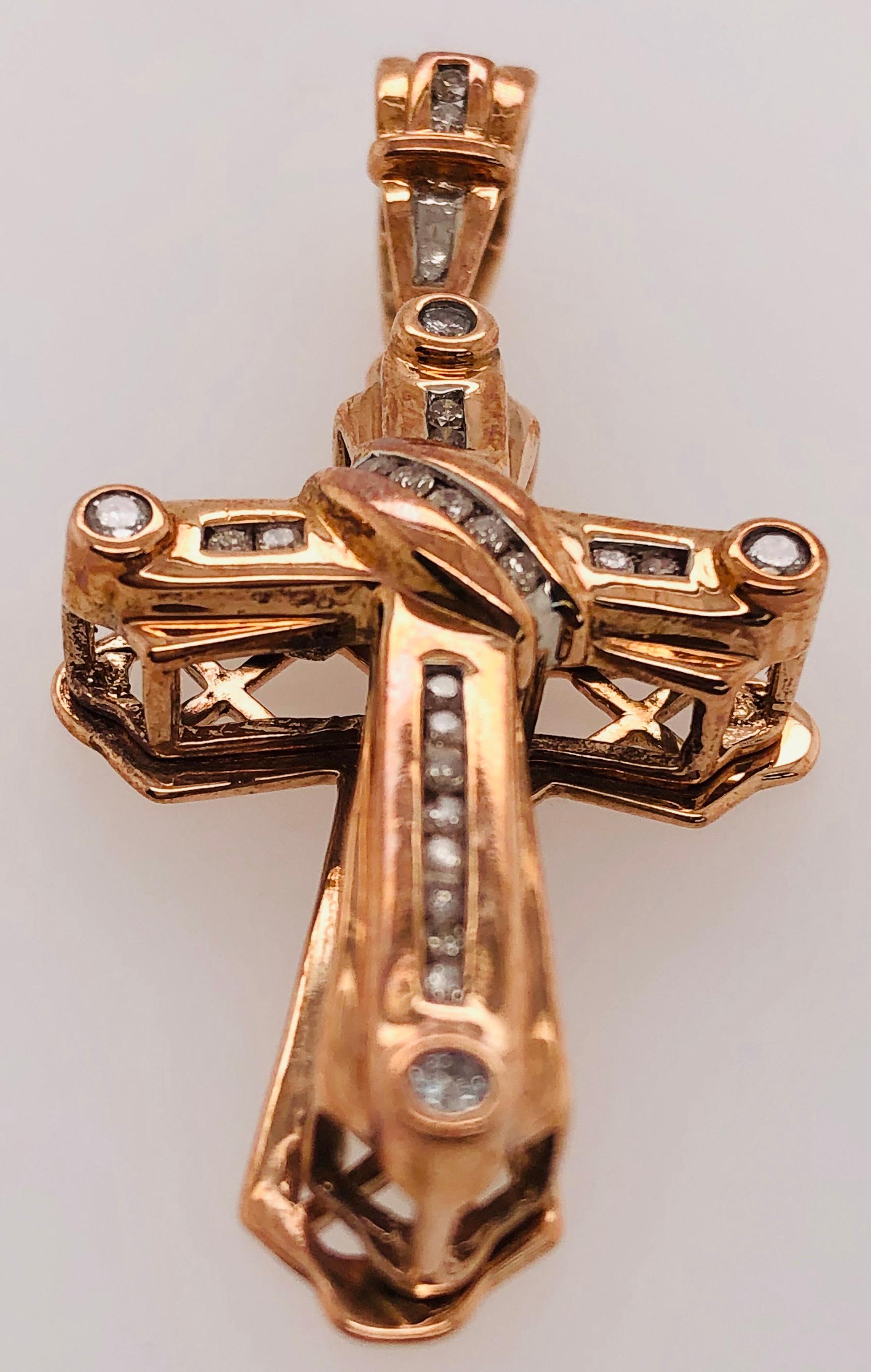 14Kt Yellow Gold Crucifix Cross Pendant with .50 Total Diamond Weight. 46.23mm Long. 23mm side and 9 mm thick. 
4.46 grams total weight