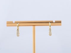 Orecchini a cerchio Huggie con diamante pendente in oro giallo 14KT