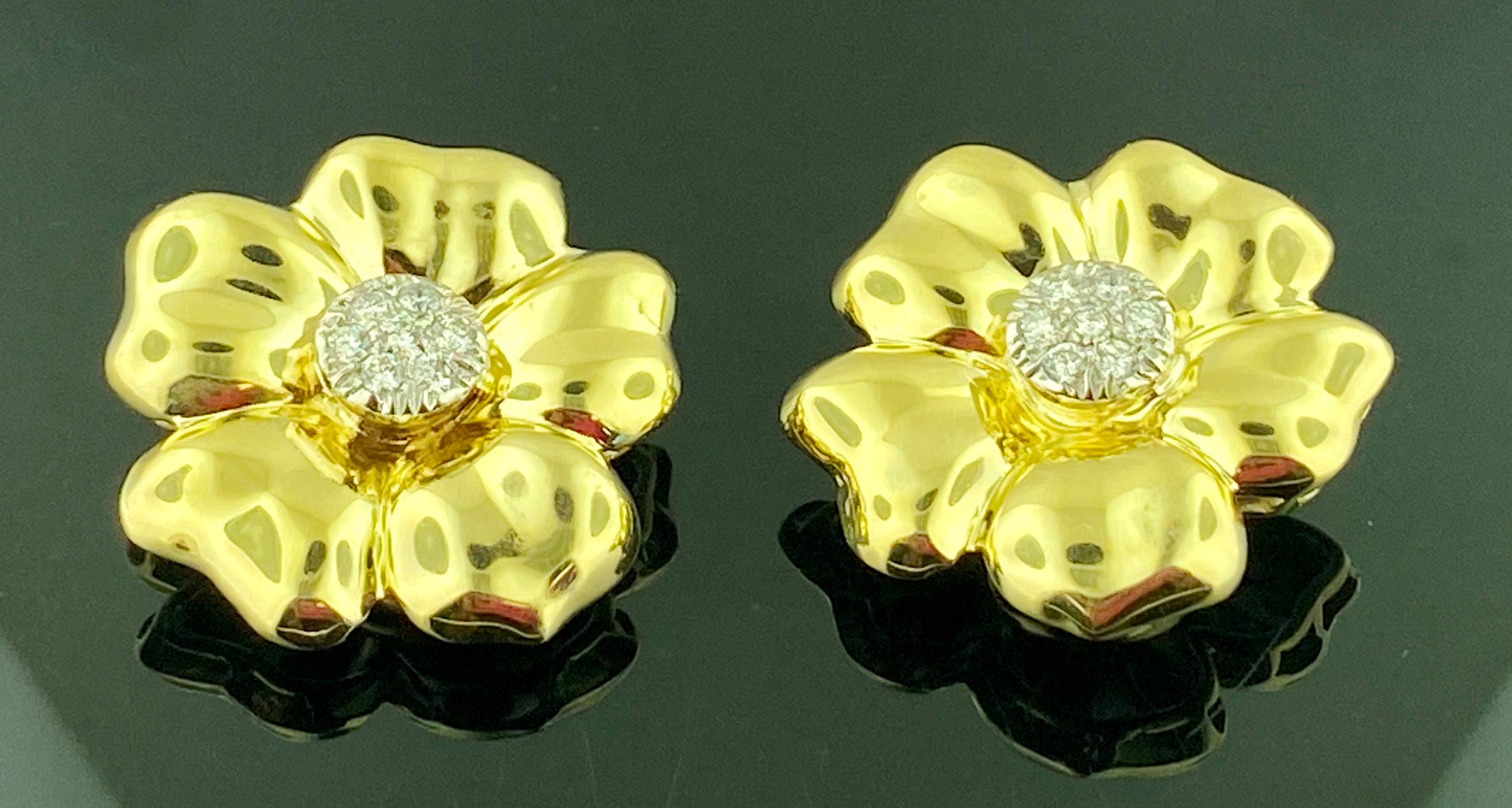 Flower shaped earrings in 14 karat yellow gold, with a gold weight of 11 grams.  There are 14 pave round brilliant cut diamonds in the centers with a total diamond weight of 0.34 carats.  Color: G-H, Clarity: VS.