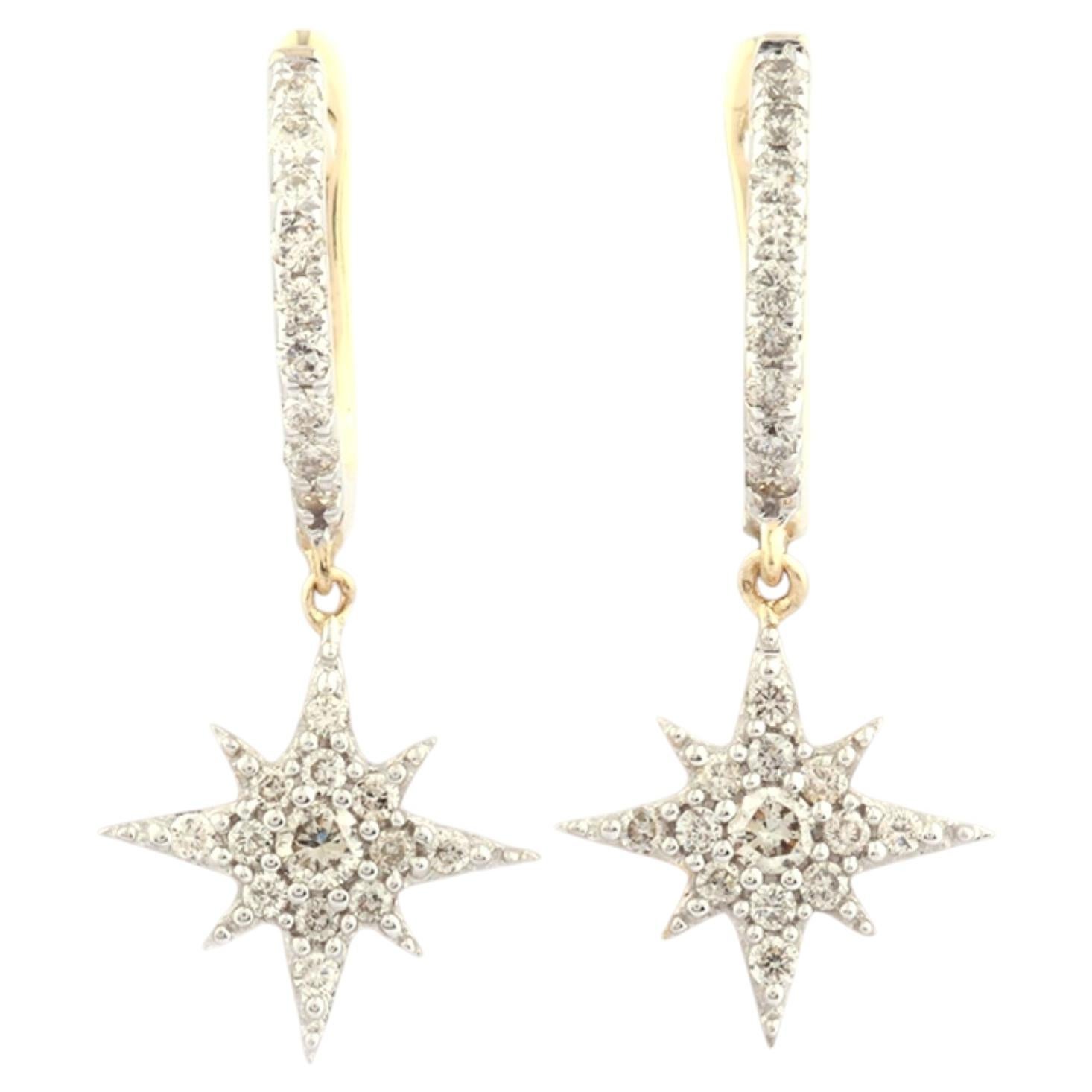 Orecchini a cerchio Huggie con stella penzolante in oro giallo 14KT