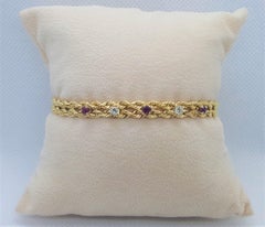 Doppelreihiges Armband aus 18 Karat Gelbgold mit Diamanten und Rubinen, 14,4 Karat