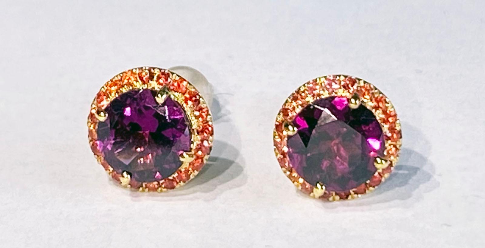 14Kt Yellow Gold Earrings set with Rhodolite Garnet & Orange Sapphire

Originally from San Diego, California, Kary Adam lived in the “Gem Capital of the World” - Bangkok, Thailand, sourcing local gem stones and working with local Metal Smiths on his