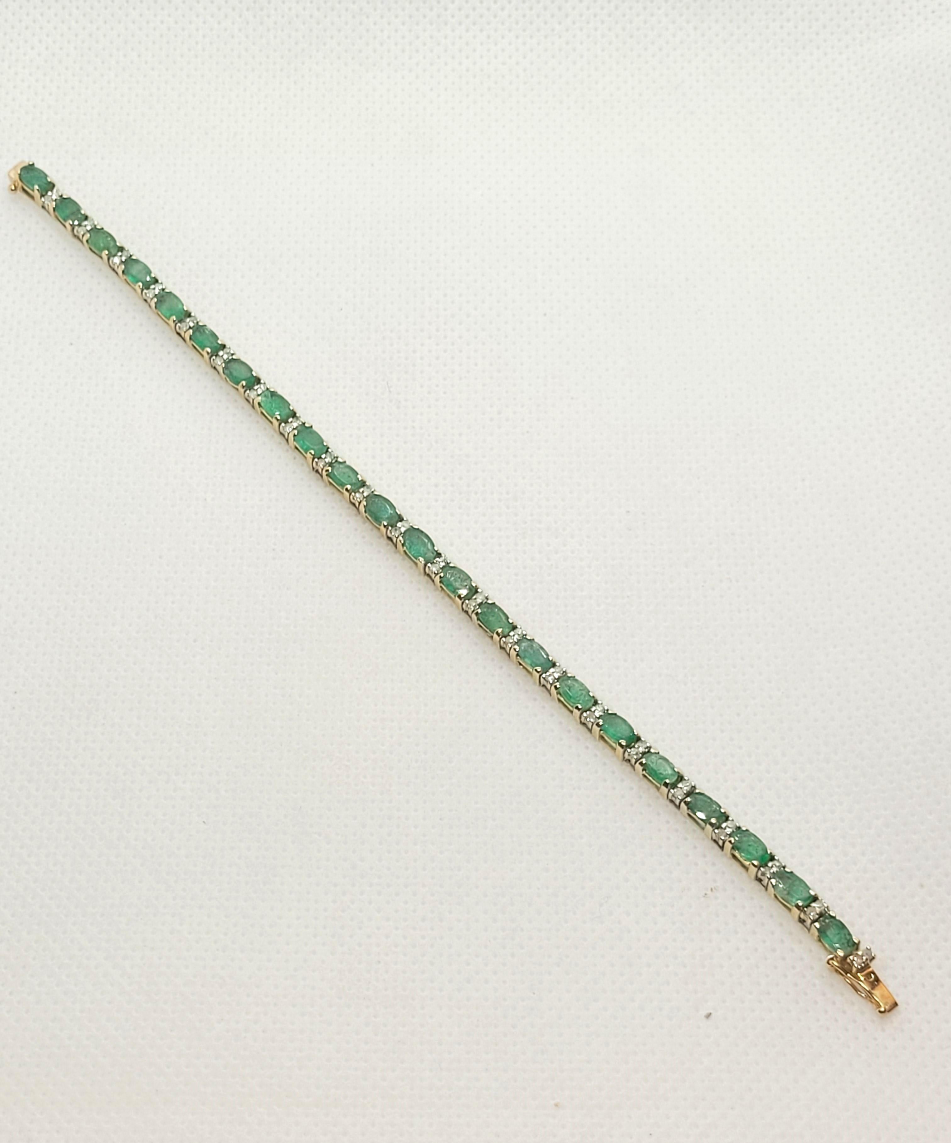 Lovely 14kt yellow gold emerald and diamond tennis bracelet of 6.25 inches in length. The 22 emeralds are oblong oval shaped at approximately .80cttw and the 44 round single-cut diamonds are at approximately .45cdttw. The diamond and emera4.8ld