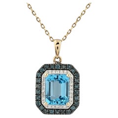 Collana con ciondolo a doppio alone in oro giallo 14 carati con topazio blu taglio smeraldo