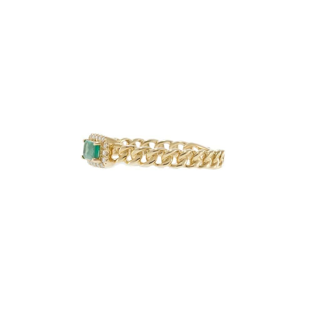 This 14KT yellow gold ring features a rectangular emerald framed by a glittering diamond halo, set atop a sleek and modern chain-link band. A slightly bolder take on its sister style, this ring offers .07 carats of round brilliant cut diamonds and a