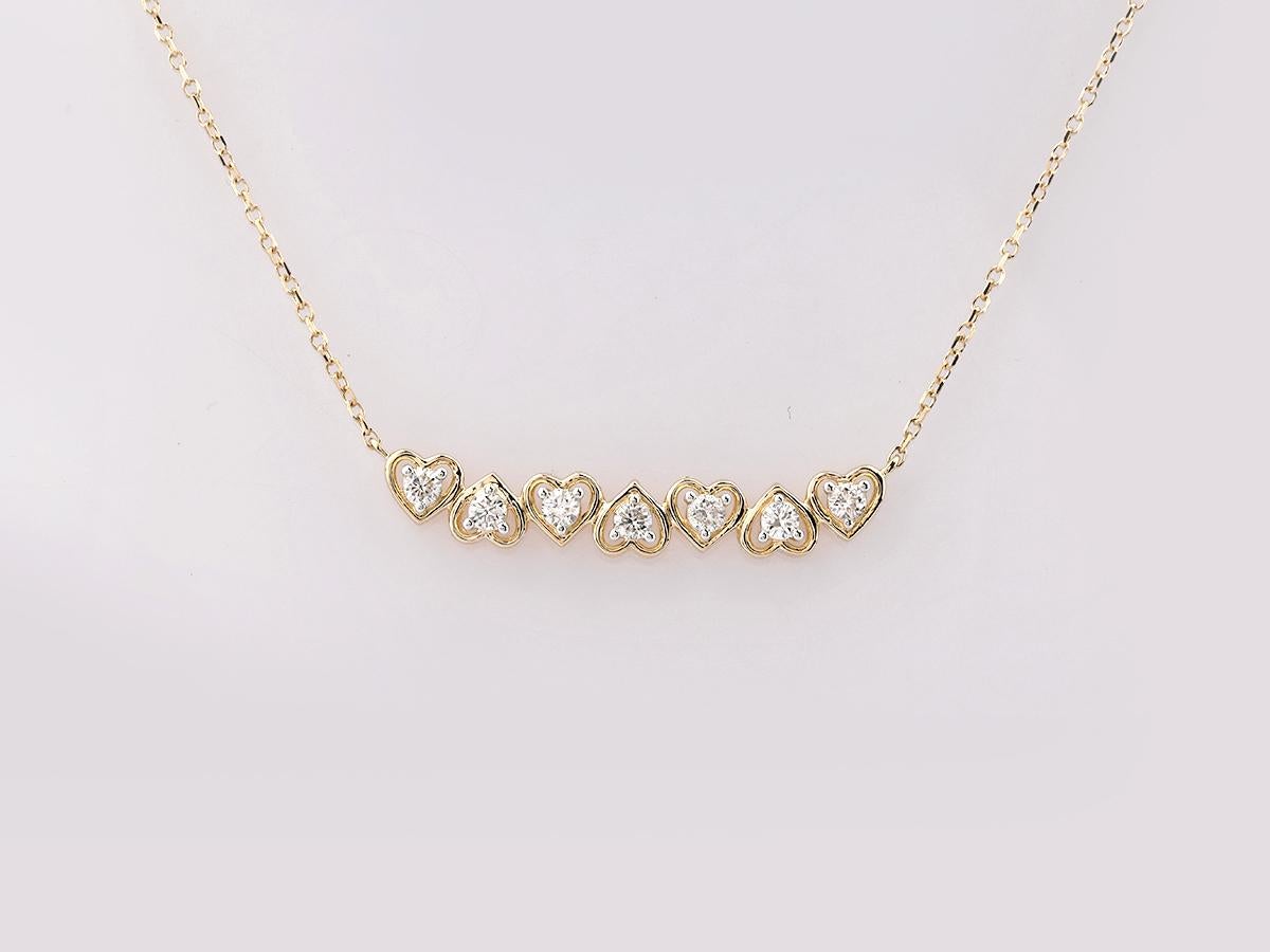 Collier en or jaune 14KT à sept cœurs gradués et diamants Pour femmes en vente