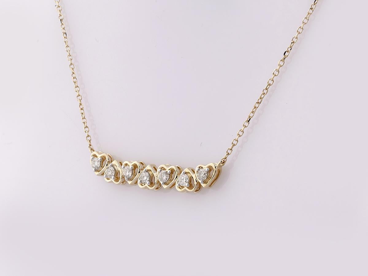 Collier en or jaune 14KT à sept cœurs gradués et diamants en vente 1