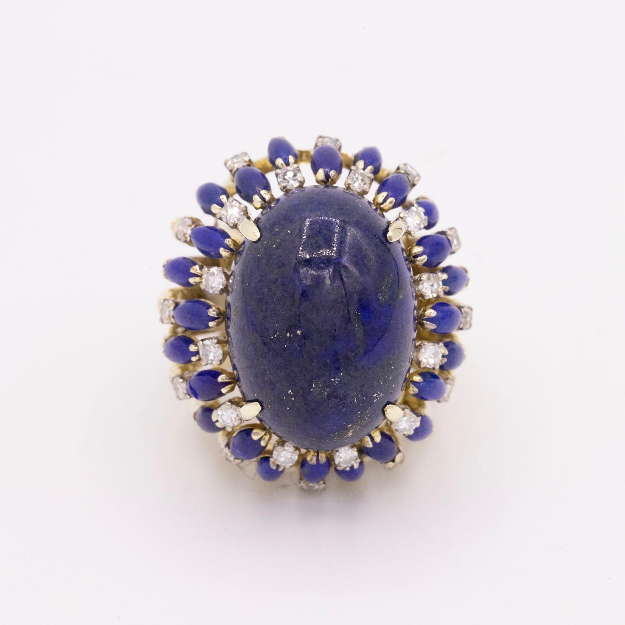 14kt Yellow Gold Lapis & Diamond cocktail ring. Oval Lapsi stone cabochon cut, measures 22mm x 16mm. Single cut diamonds with colors between G-H and a clarity of SI1. The total weight of the diamonds is 1.10 carats. This ring measures at a size 5.