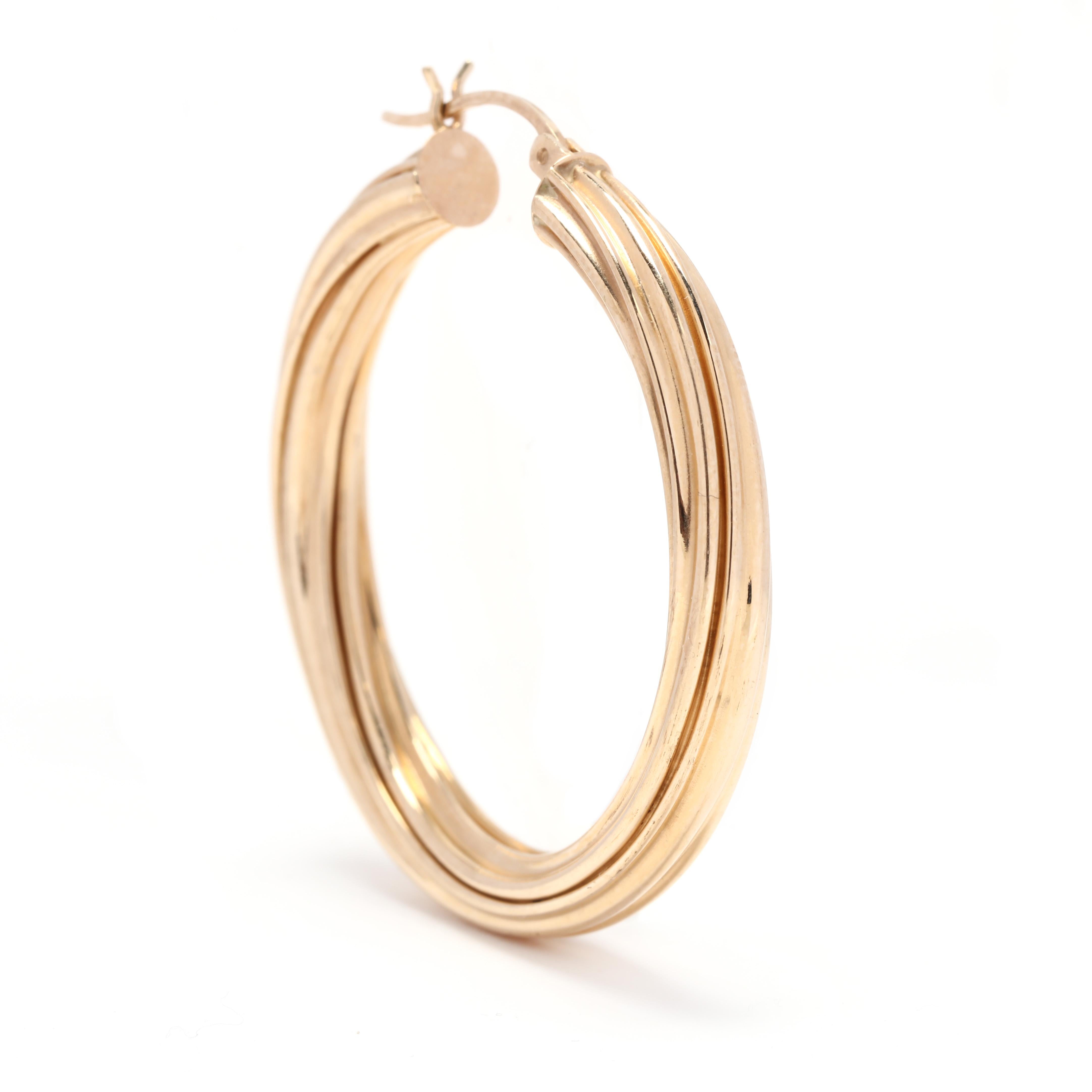 A pair of 14 karat yellow gold large twist hoop earrings. These earrings feature a circular design with a twist cable motif.

Length: 1.5 in.

Width: 5 mm

4.9 dwts.

A Couple Of Things to Note:
* This is a vintage item and may show signs of wear.