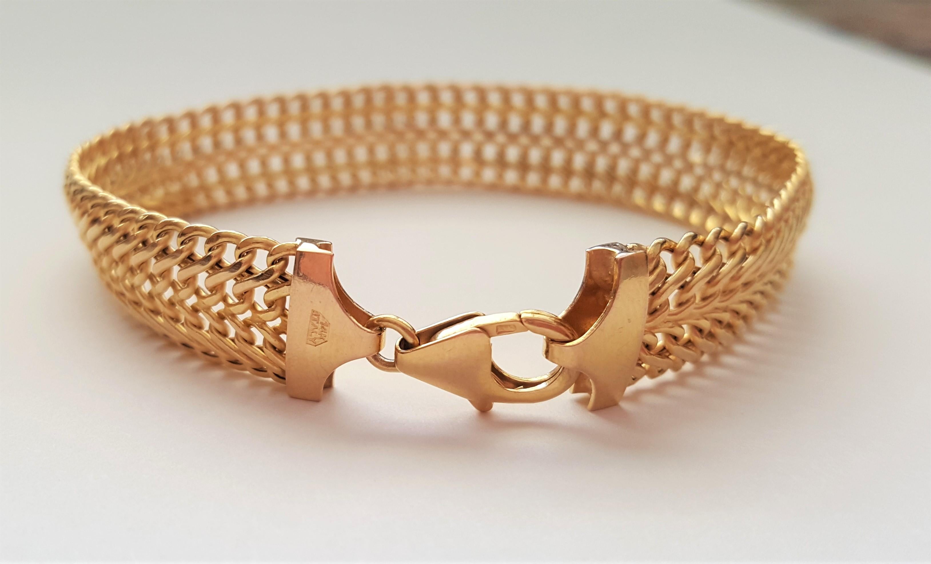 14kt gold mesh-style Italian Milor designer bracelet. The bracelet is 7 inches long, 10.6mm wide, 8.2 grams in weight. Secured with a lobster clasp and stamped 14kty Italy. Overall, this bracelet is in very good condition and appears hardly worn.