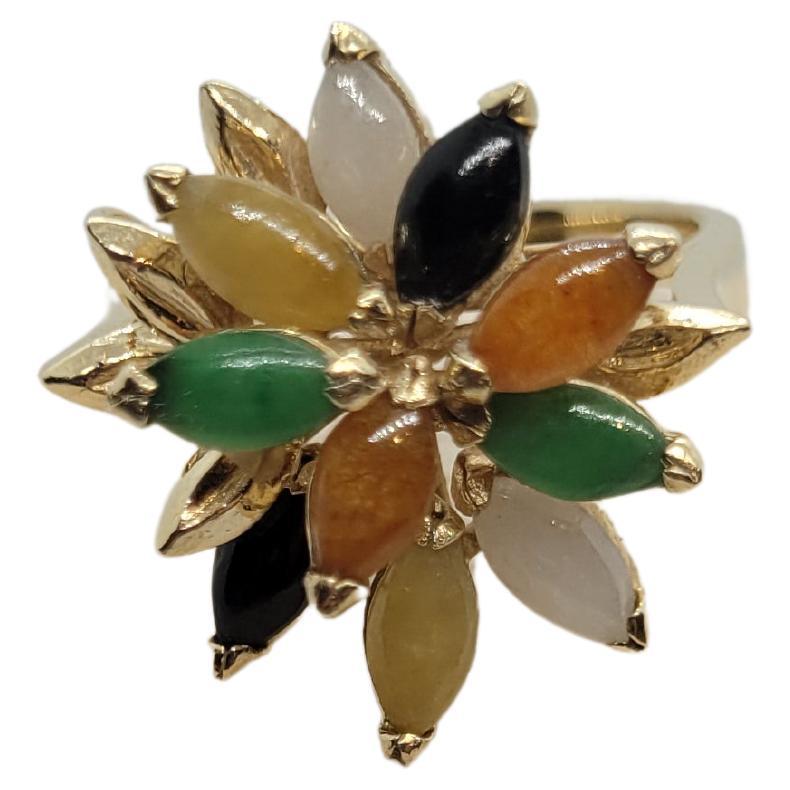 Lovely 14kt yellow gold ring with 11 marquis shaped jade of multi-colors white, black, orange, yellow, and green. This ring is size 6 and in very good condition and the weight is 5.5 grams. Please let us know if you have any questions. 

Rock N Gold