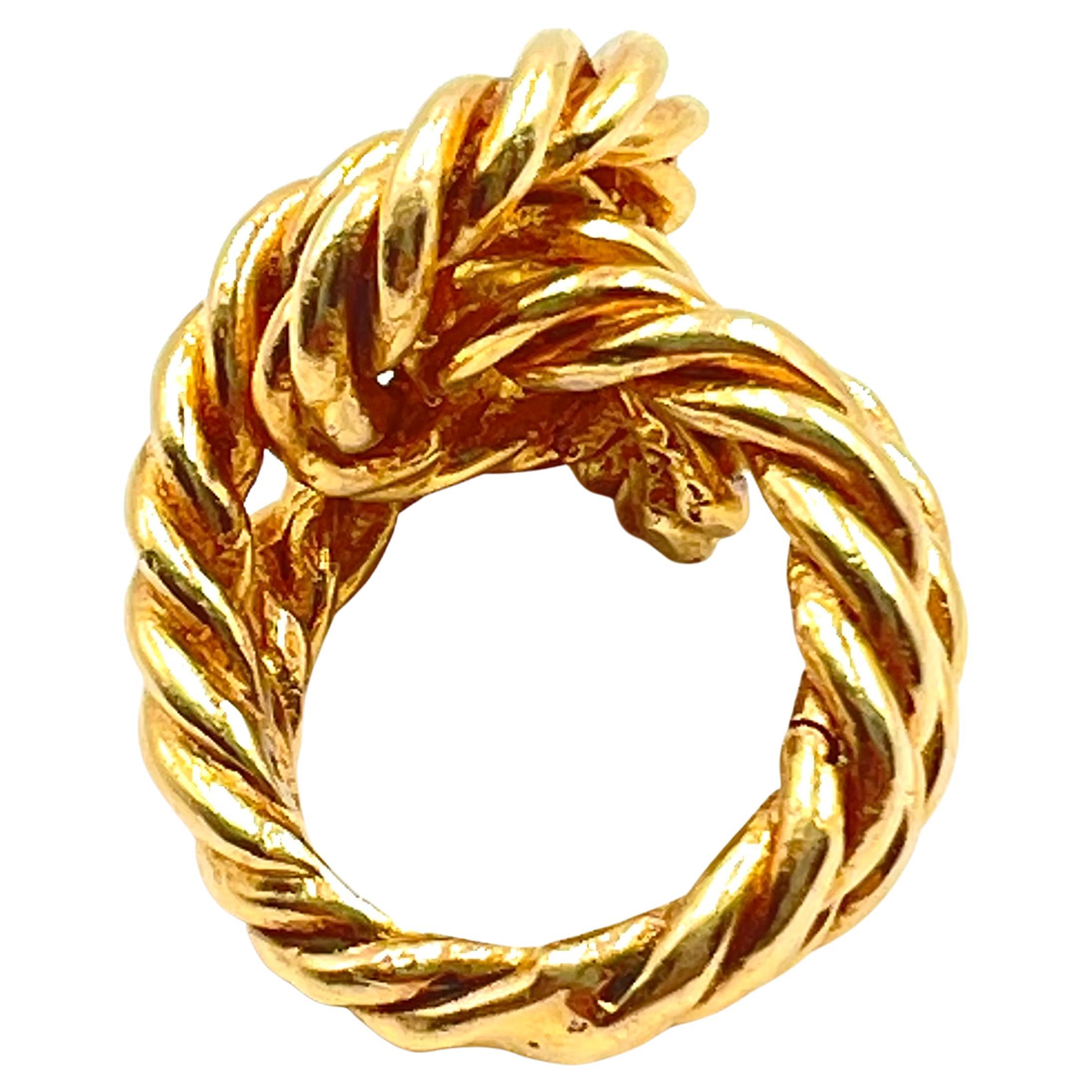 Nautical rope style knot design ring in 14kt yellow gold, measuring approximately 22.8mm and tapering to 3.9mm at the bottom of shank.  The rope design runs through the entire circumference of the ring.  Stamped 