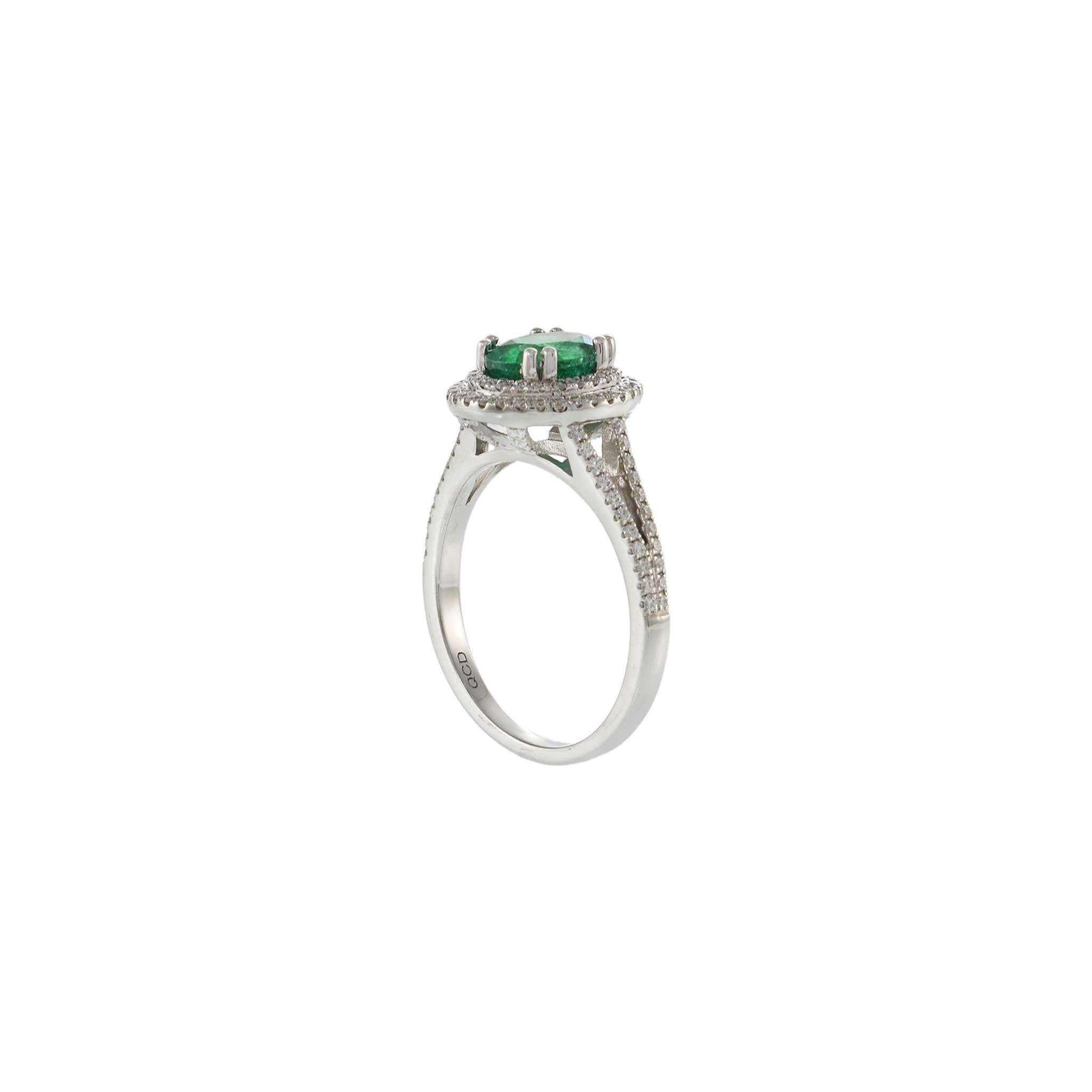 Modern 14KT Yellow Gold Oval Cut Emerald and Diamond Double Halo Ring For Sale