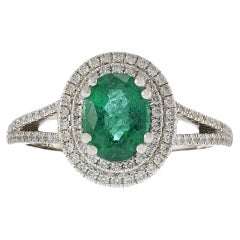 14KT Yellow Gold Oval Cut Emerald and Diamond Double Halo Ring