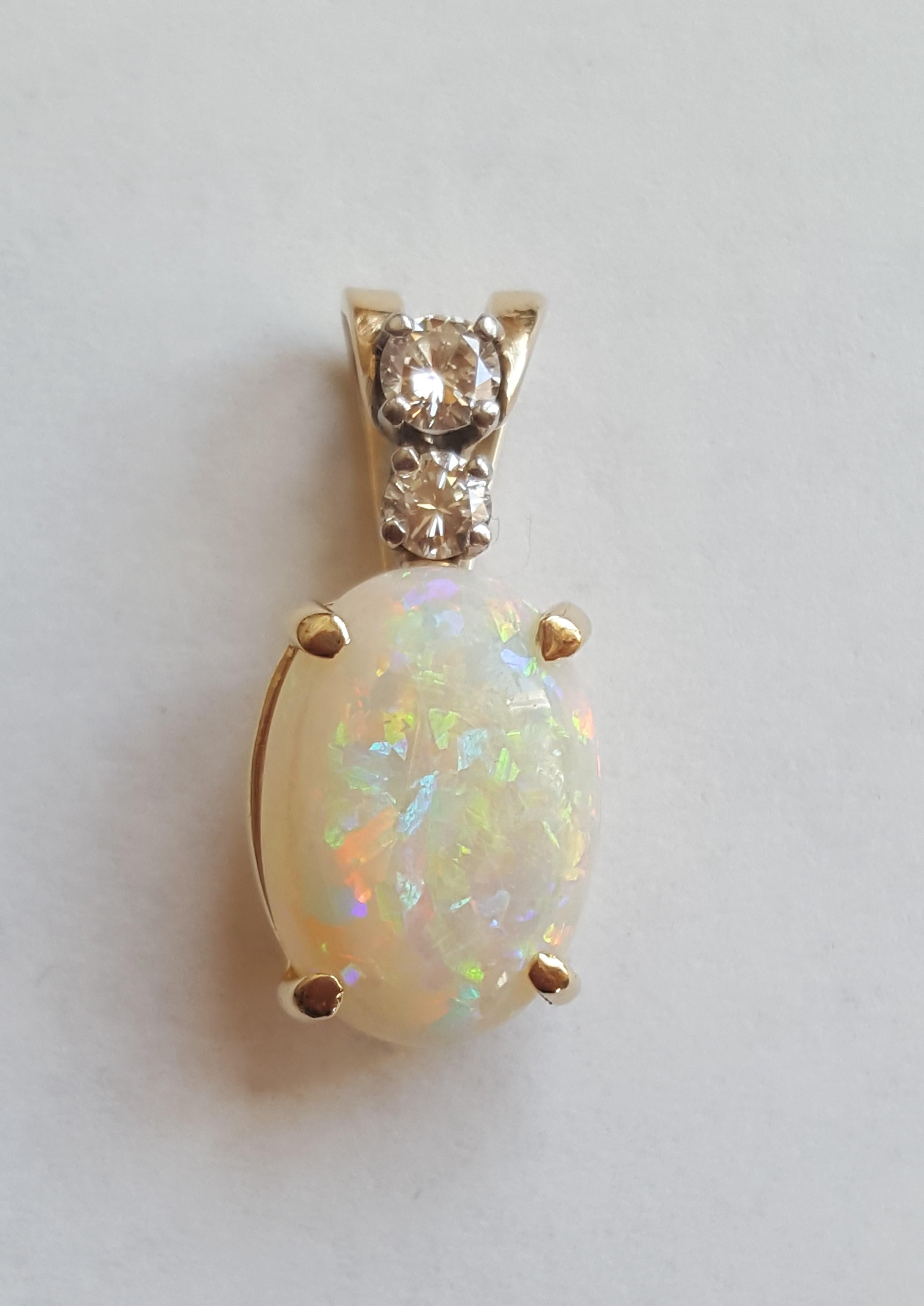 Contemporary 14 Karat Yellow Gold Oval Opal, Round Brilliant Diamond Three-Stone Pendant