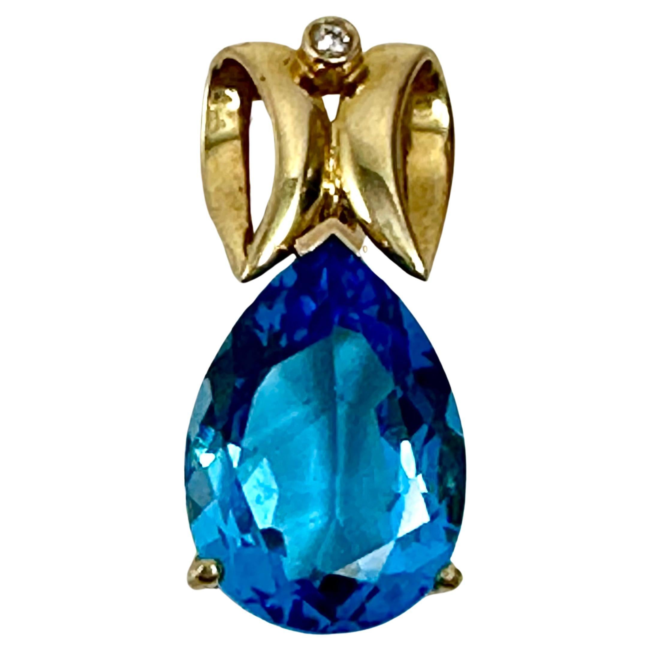 14kt Yellow Gold Pear Shape London Blue Topaz 2mm Diamond 1 1/4" Pendant For Sale