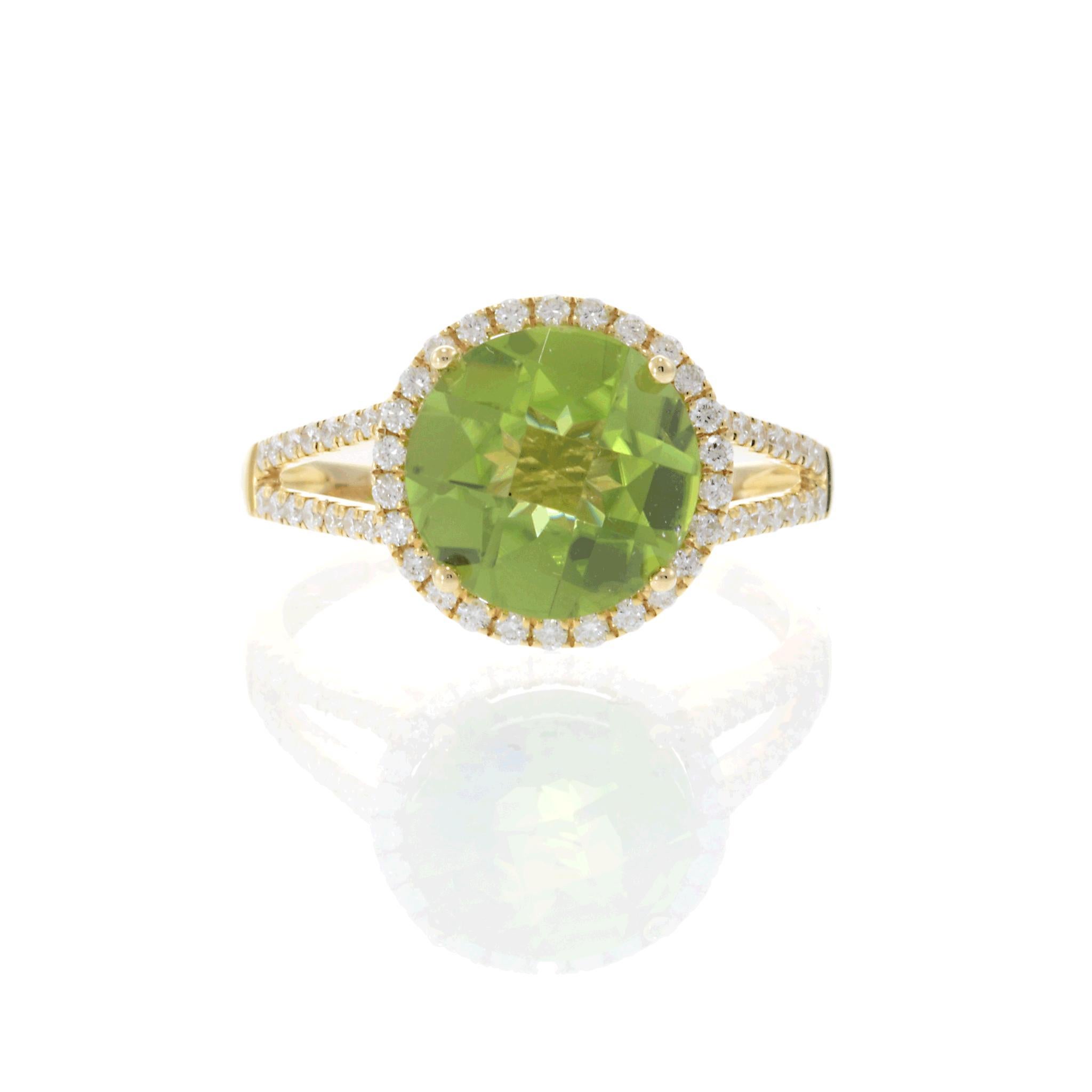 A symphony of color and brilliance.

This striking ring showcases a vibrant 4.14 carat round peridot, its lush green hue radiating from the center. Encircling the peridot, a halo of round white diamonds, totaling 0.42 carats, adds a dazzling