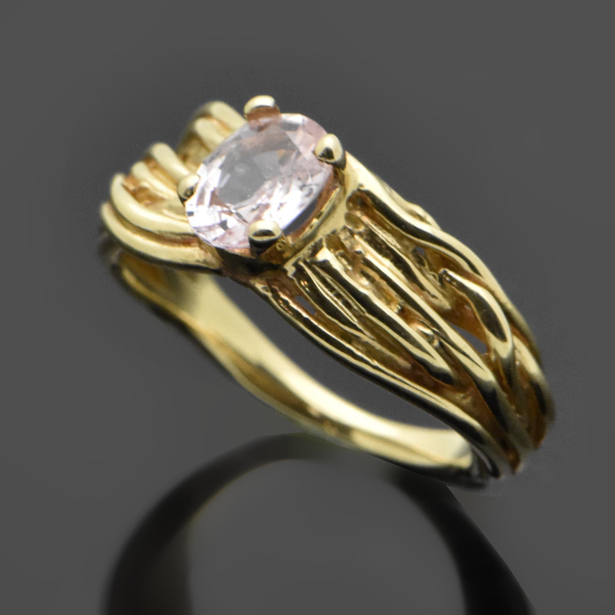 This 14kt yellow gold ring is set with an oval-cut pink sapphire estimated weight at 1.10ct and features a branch-like ring design. Estimated weight of gold is 3.5 gr. 

We will size it for you.

