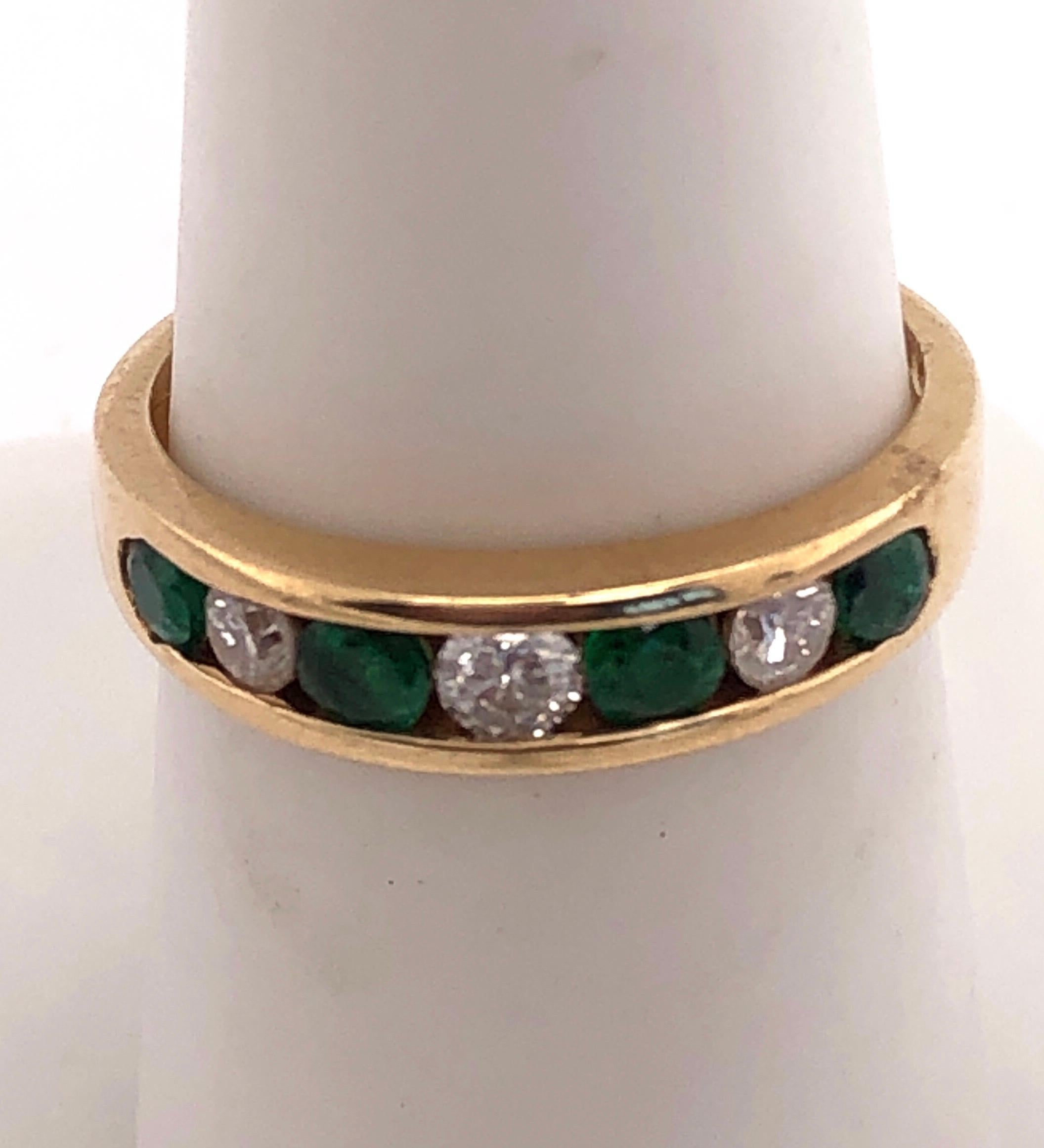 14 Karat Gold Ring or Wedding Band Seven-Stones Emerald and Diamond .36TDW For Sale 1