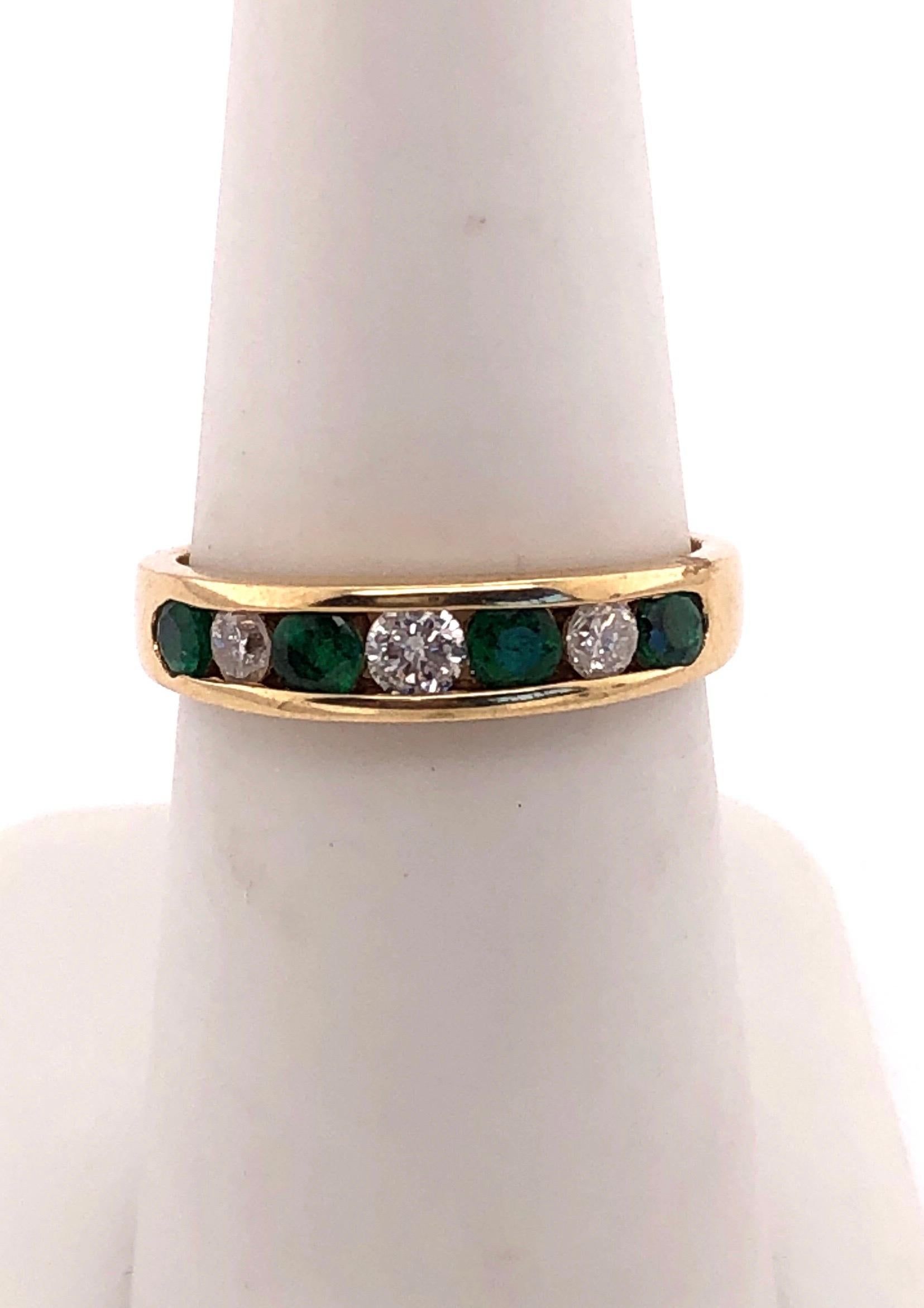 14 Karat Gold Ring or Wedding Band Seven-Stones Emerald and Diamond .36TDW For Sale 2