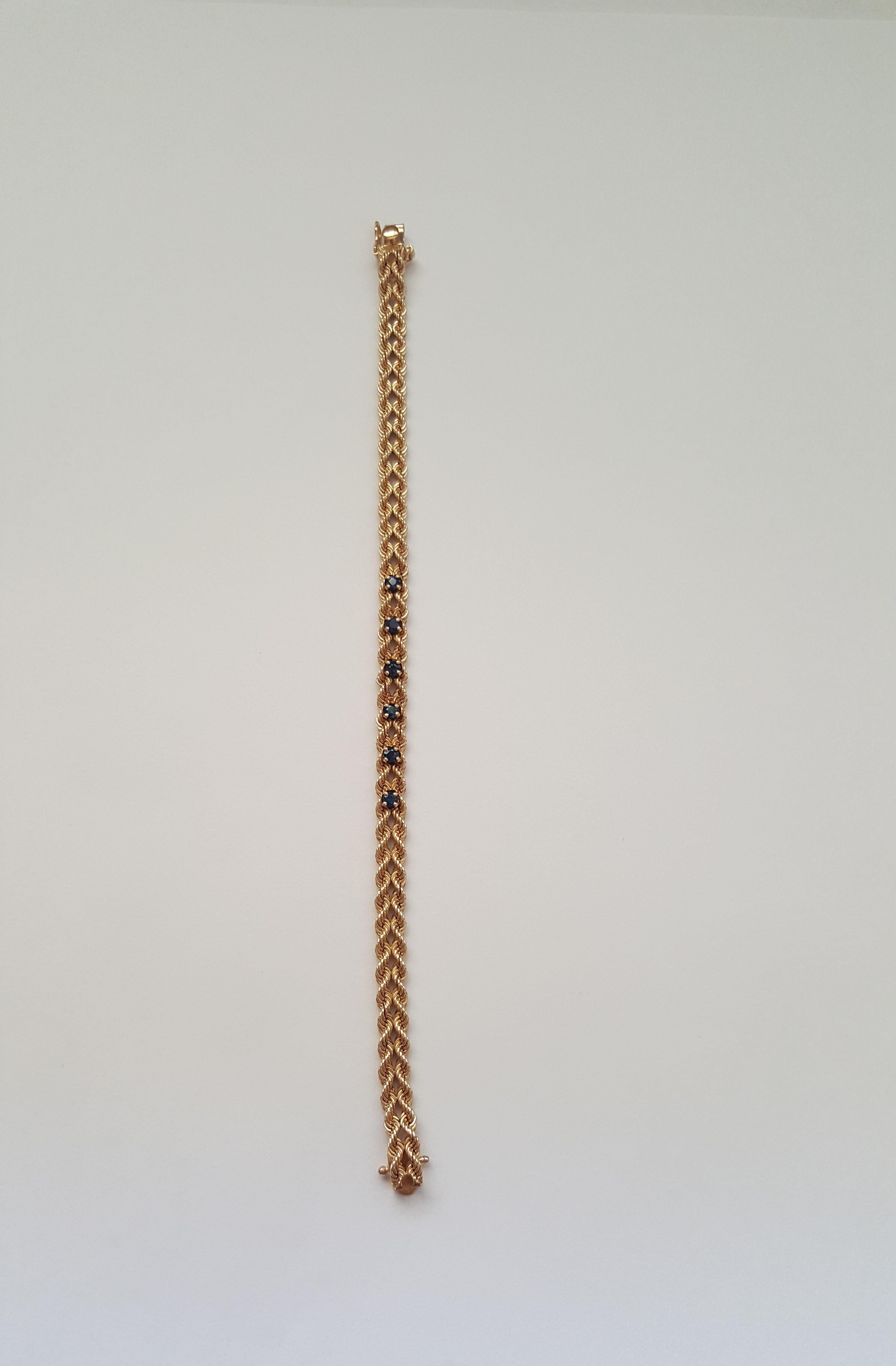 14kt Yellow Gold Rope Sapphire Bracelet, 12.1 grams, 7 inches length, 6- 3mm Round Blue Sapphires, 5mm wide, Push In Clasp with 2 figure 8 safely clasps. Double Rope. It's stamped 14kt and has a stamp that looks like 