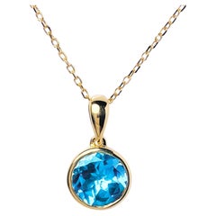Collana con ciondolo solitario con castone in oro giallo 14KT con taglio rotondo in Topazio Blu Svizzero
