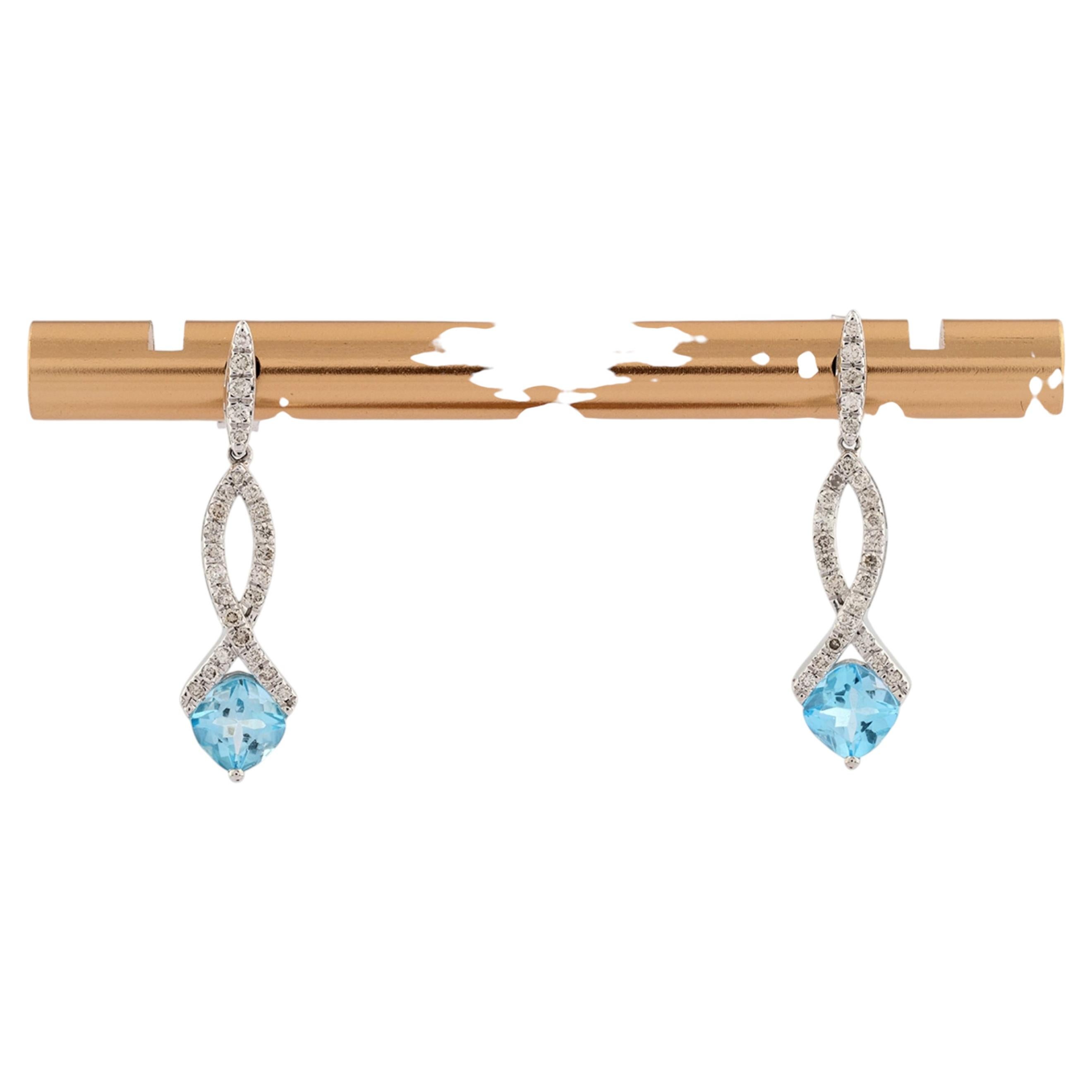 Orecchini pendenti Infinity con diamante rotondo e topazio blu in oro giallo 14KT in vendita