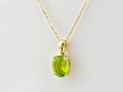Collier en or jaune 14KT avec pendentif solitaire en péridot taillé en ovale
