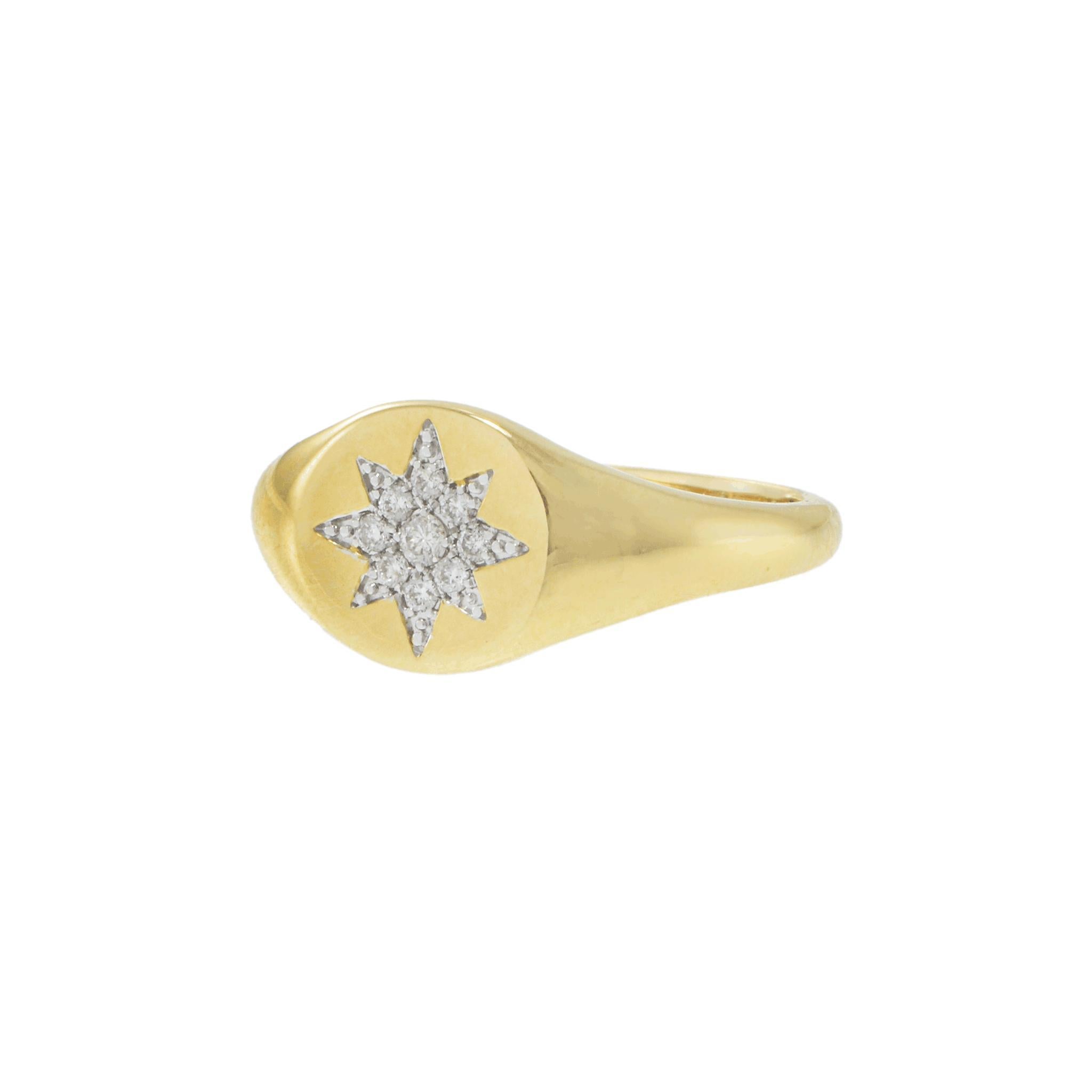A refined and elegant ring featuring a central star motif adorned with round-cut white diamonds totaling 0.1 carats.

The diamonds are set in a radiant pattern, enhancing the brilliance of the design. Crafted in 14k yellow gold, the ring exudes a