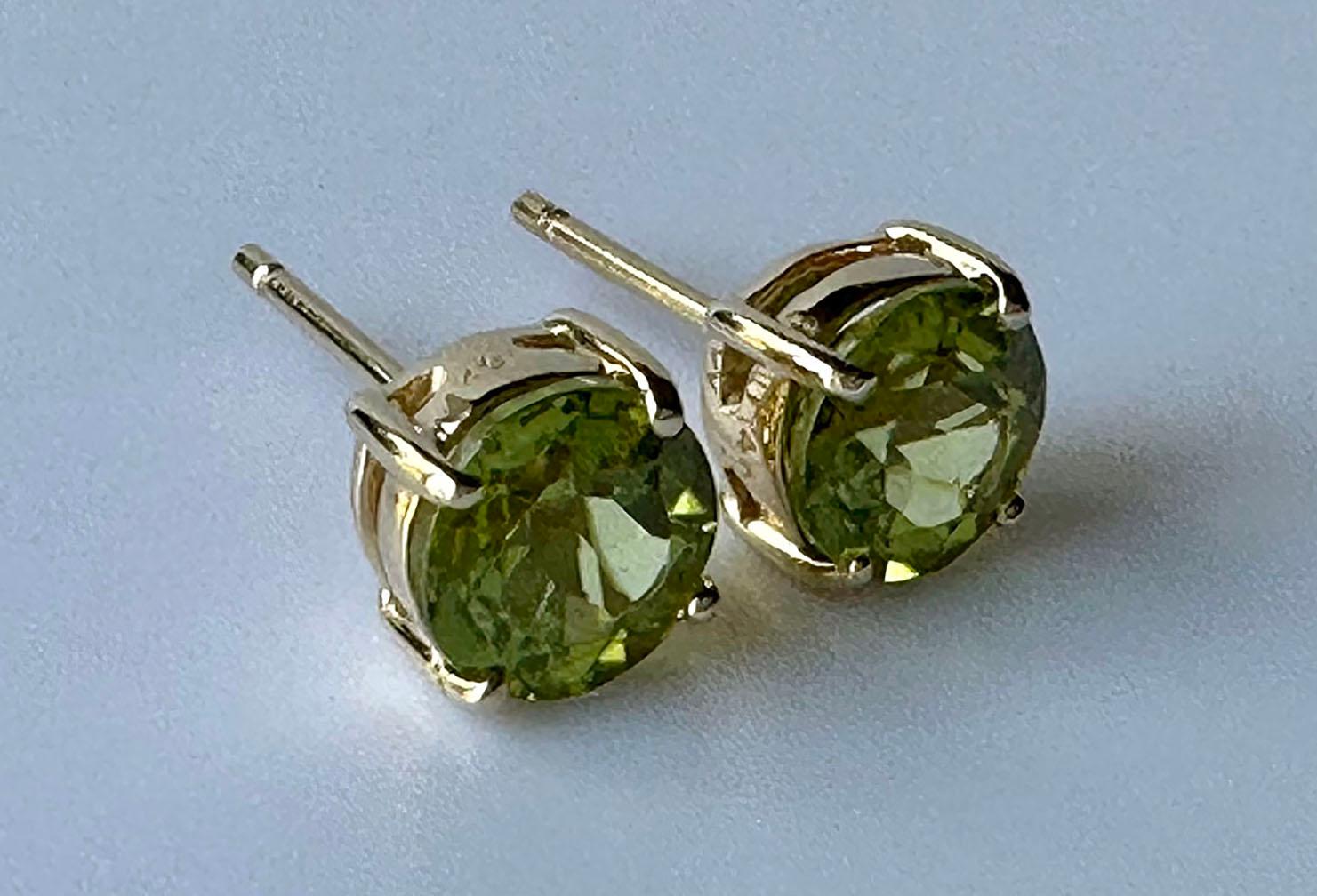14kt Yellow Gold Stud Earrings set with Peridot/Olivine round brilliants. 
These are simple stylish and match anything. 

Originally from San Diego, California, Kary Adam lived in the “Gem Capital of the World” - Bangkok, Thailand. He frequently