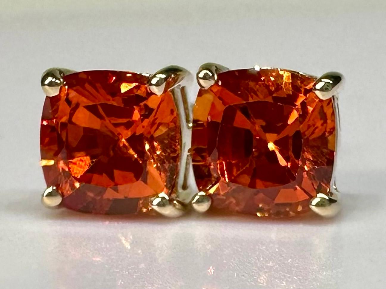 An important pair of 14kt Yellow Gold Stud Earrings with Cushion Cut Orange Sapphires. 

Originally from San Diego, California, Kary Adam lived in the “Gem Capital of the World” - Bangkok, Thailand. He frequently makes trips there sourcing local