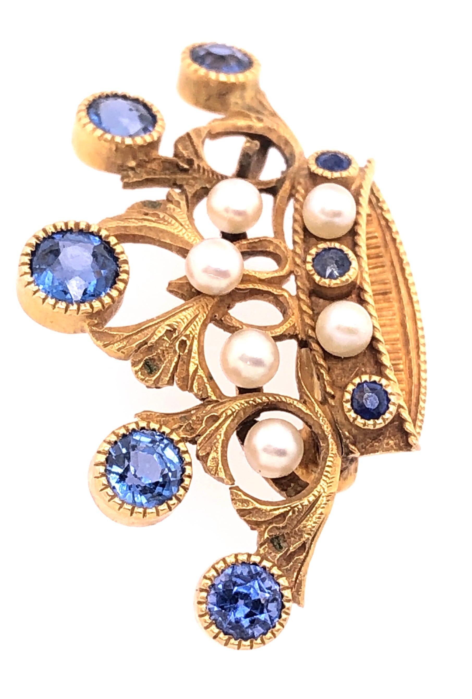 14Kt Yellow Gold Tiara Crown Pin or Brooch with Stones and Pearls. 19.25 by 33.5 mm in width. Pearls approx 3mm in diameter. Larger Sapphire is 5mm. Bearing unknown makers hallmark. 
