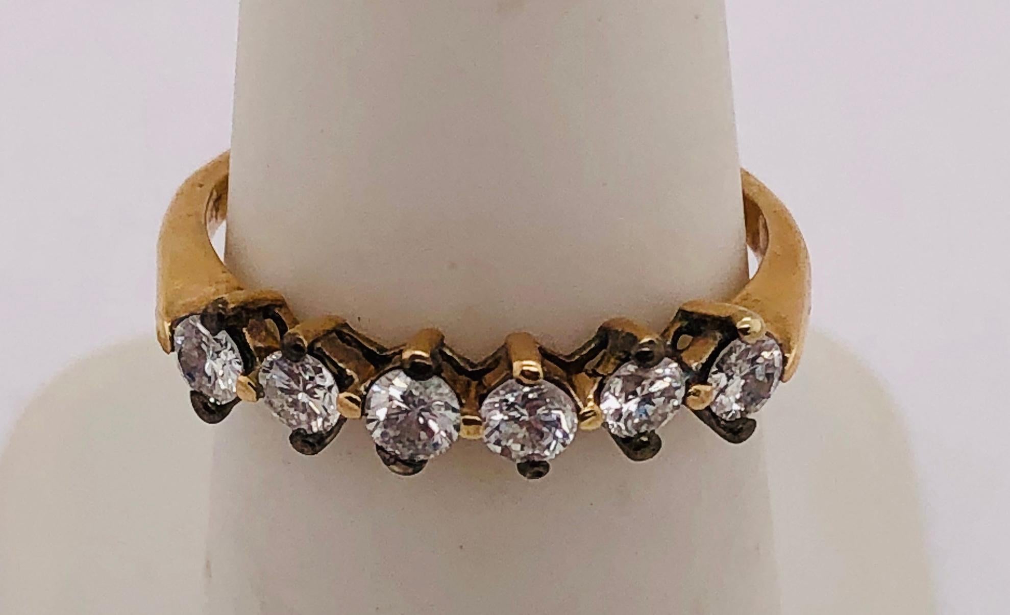 14Kt Yellow Gold Ring with Diamond 0.60 Total Diamond Weight
Size 6.25 grams total weight 
2.11 grams total weight