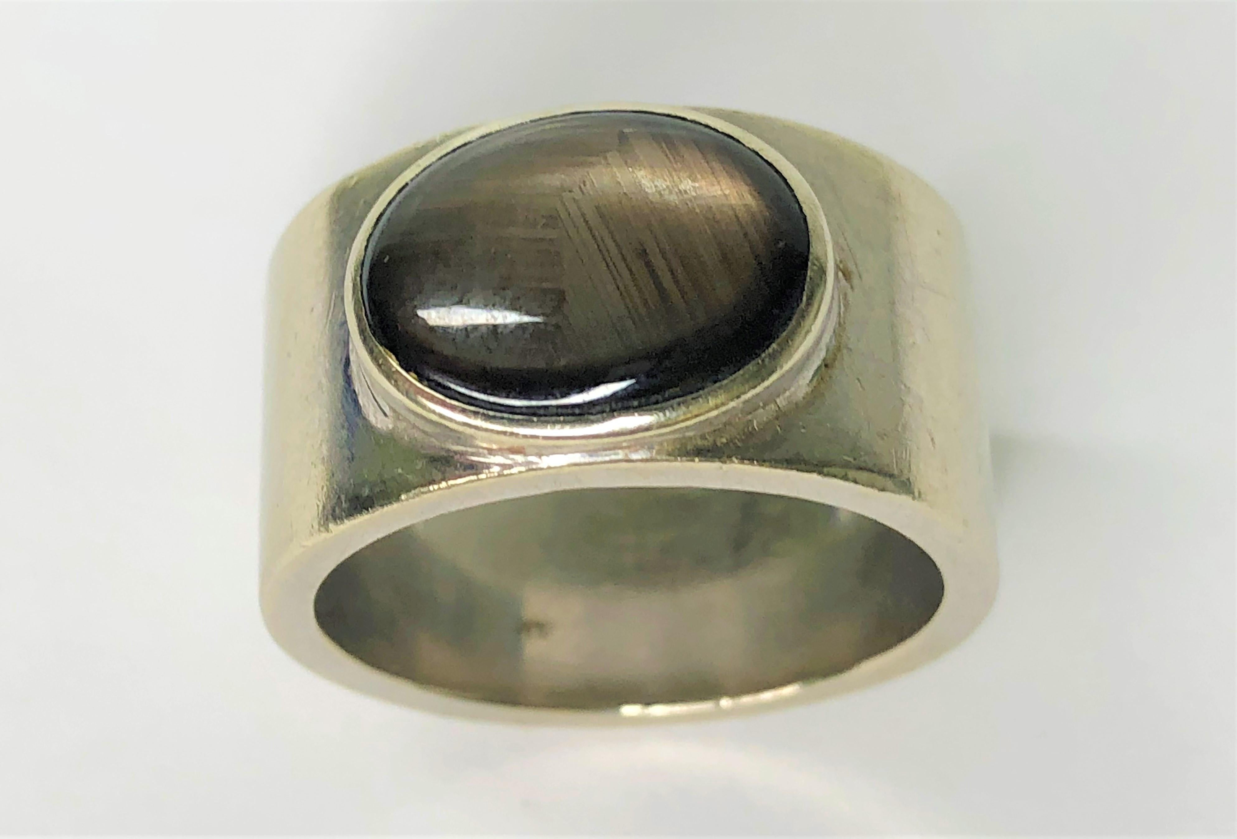 This will be a perfect everyday ring for anyone!
14K white gold.
12.2mm wide.
Oval star sapphire, approximately 13mm x 9mm.
There is patina on the band, please see pictures.  This can be polished out, if desired.
Approximate size 10.5
15dwt