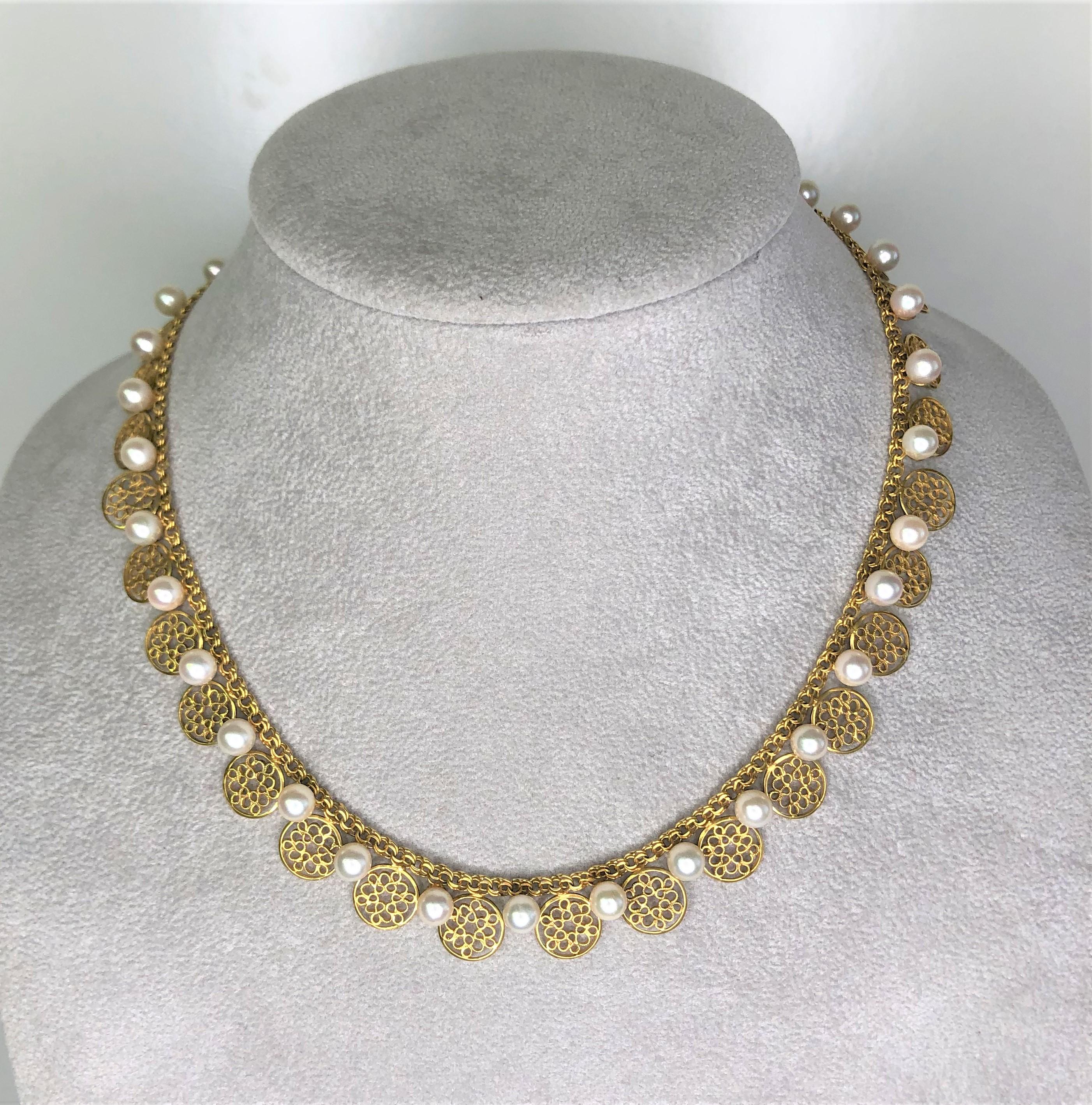 This one-of-a-kind piece will get noticed!  Dress it up or down, wear it every day!
14 karat yellow gold. 
16 inches long and adjustable to 14.5 inches
34 white 5-5.5mm high luster cultured pearls.
33 circle 'floral' cut out detail, approximately