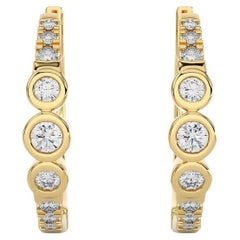 14KY Gold - Modern  Diamond Huggie Earrings. (0.23 Ct)
