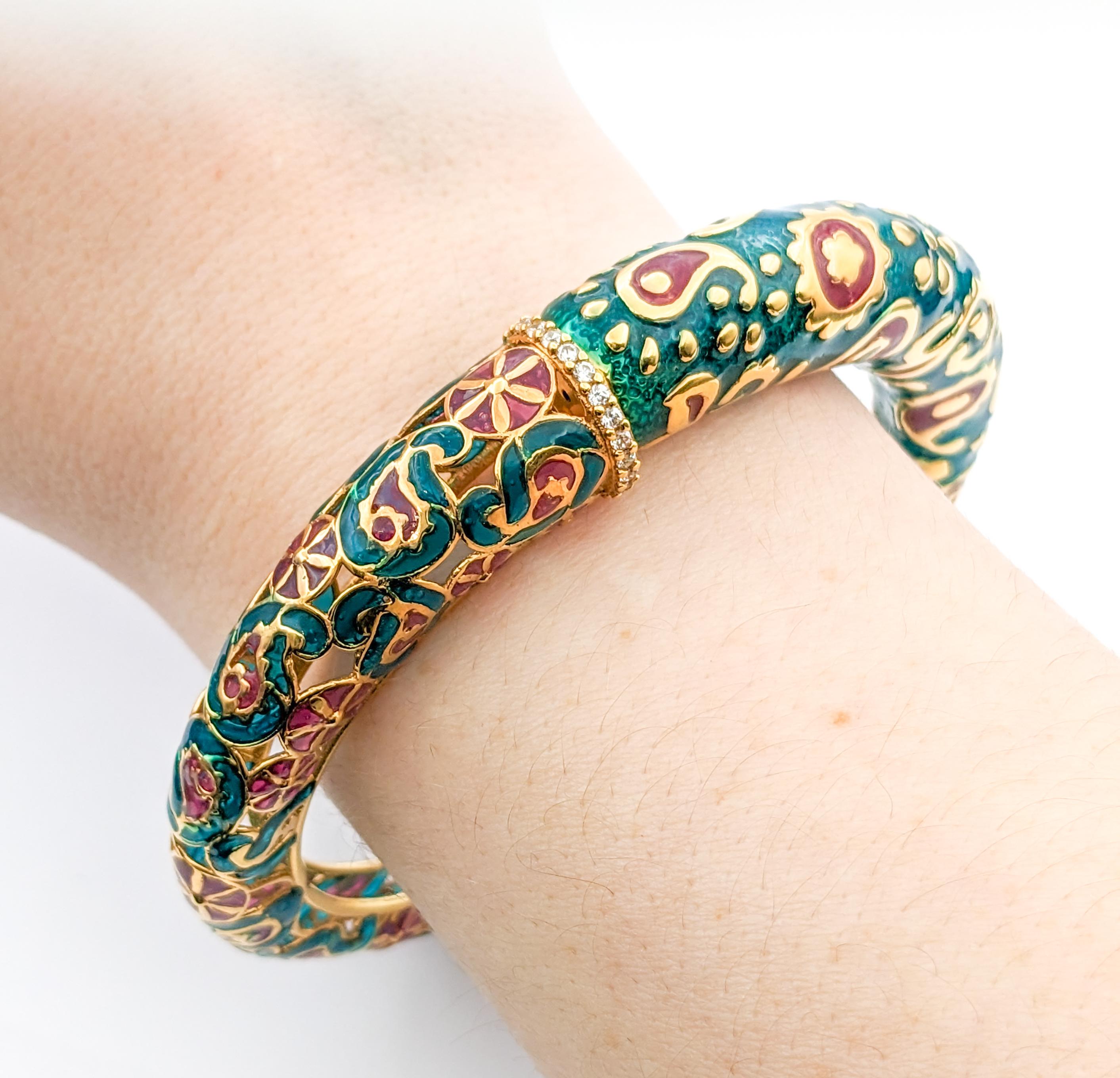 14ky Green & Red Enamel Bangle Bracelet 

 This unique bracelet is crafted in 14k yellow gold. The piece features a green and red enamel paisley pattern as well as CZs. The length is 6.5 inches and the weight is 23.84 grams.

14k Yellow Gold
Enamel