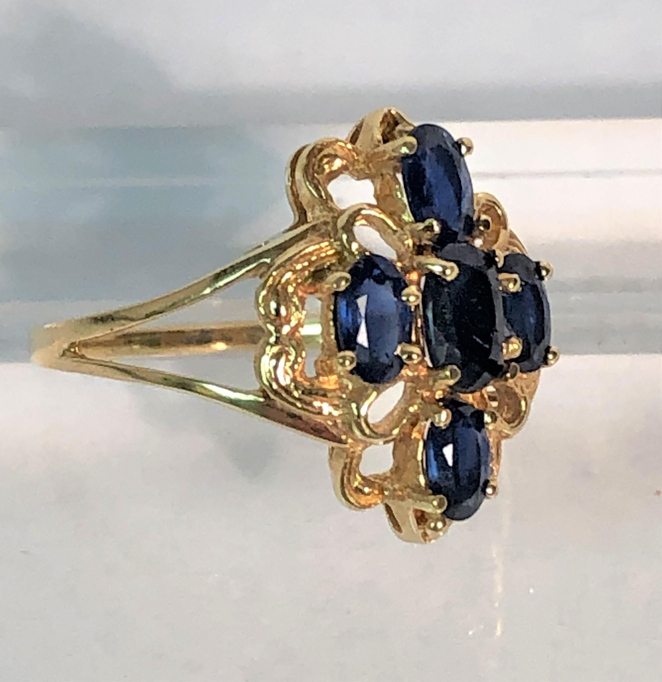This beautiful sapphire ring is perfect for every day!
14 karat yellow gold elegant filigree setting. 
Split shank.
5 oval sapphires ranging from approximately .20ct to .30ct each, approximately 1.10 tcw
Stamped 