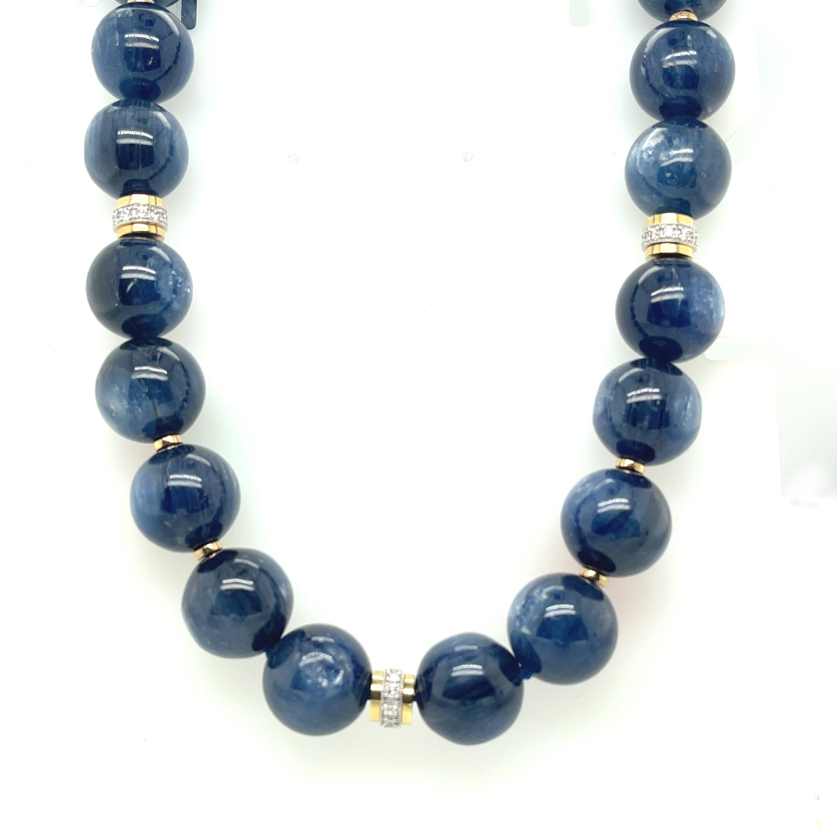 This blue kyanite gemstone beaded necklace is breathtakingly luminescent with its gorgeous silvery white sheen and luxurious satin-like appearance! The 14mm kyanite beads display varying shades of rich, medium blue and have been hand-strung and