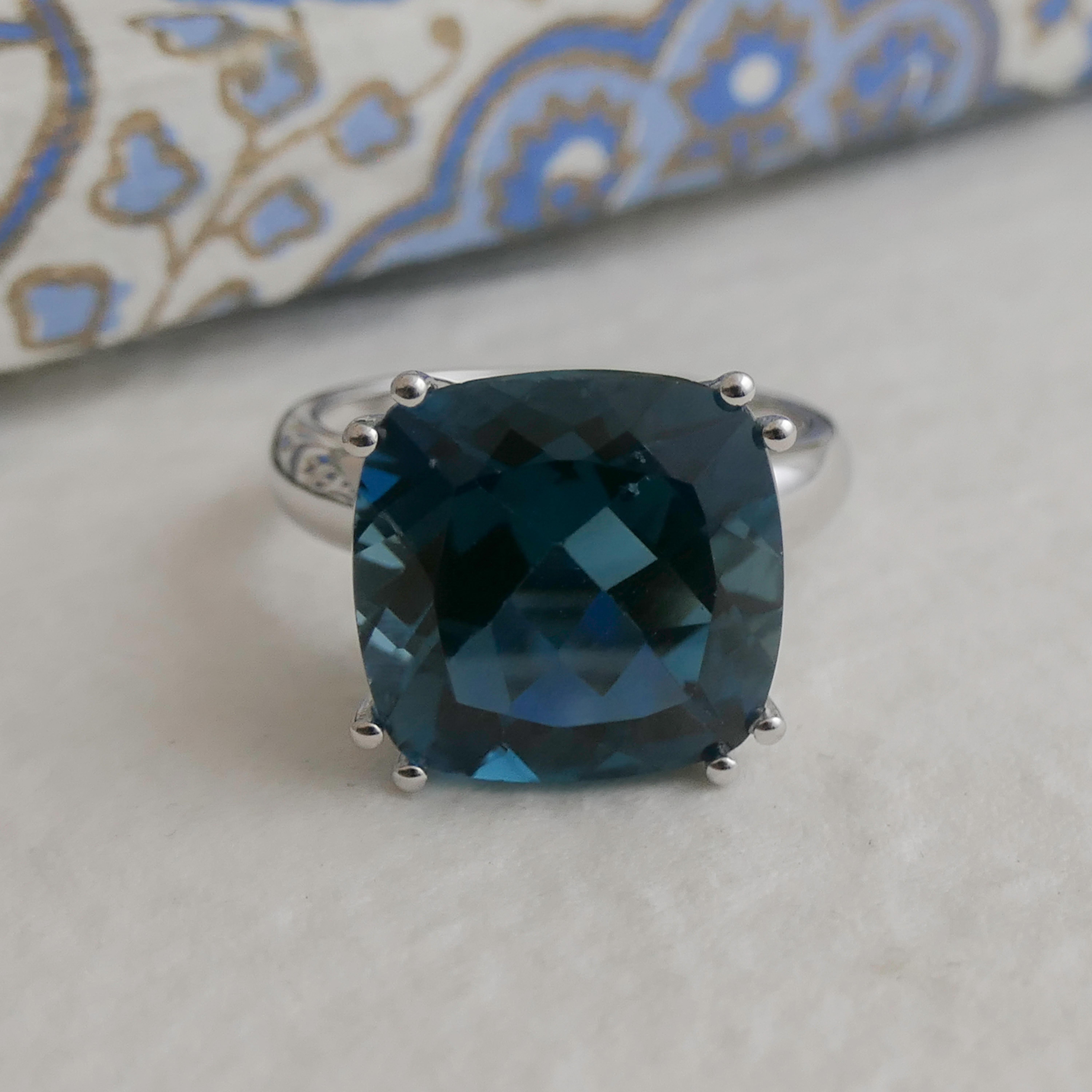 14x14mm Cushion Cut London blue Topaz is prong set in sterling silver.  

Available in sizes 6, 7  8 and 9.   Please let me know what size you want when you order.