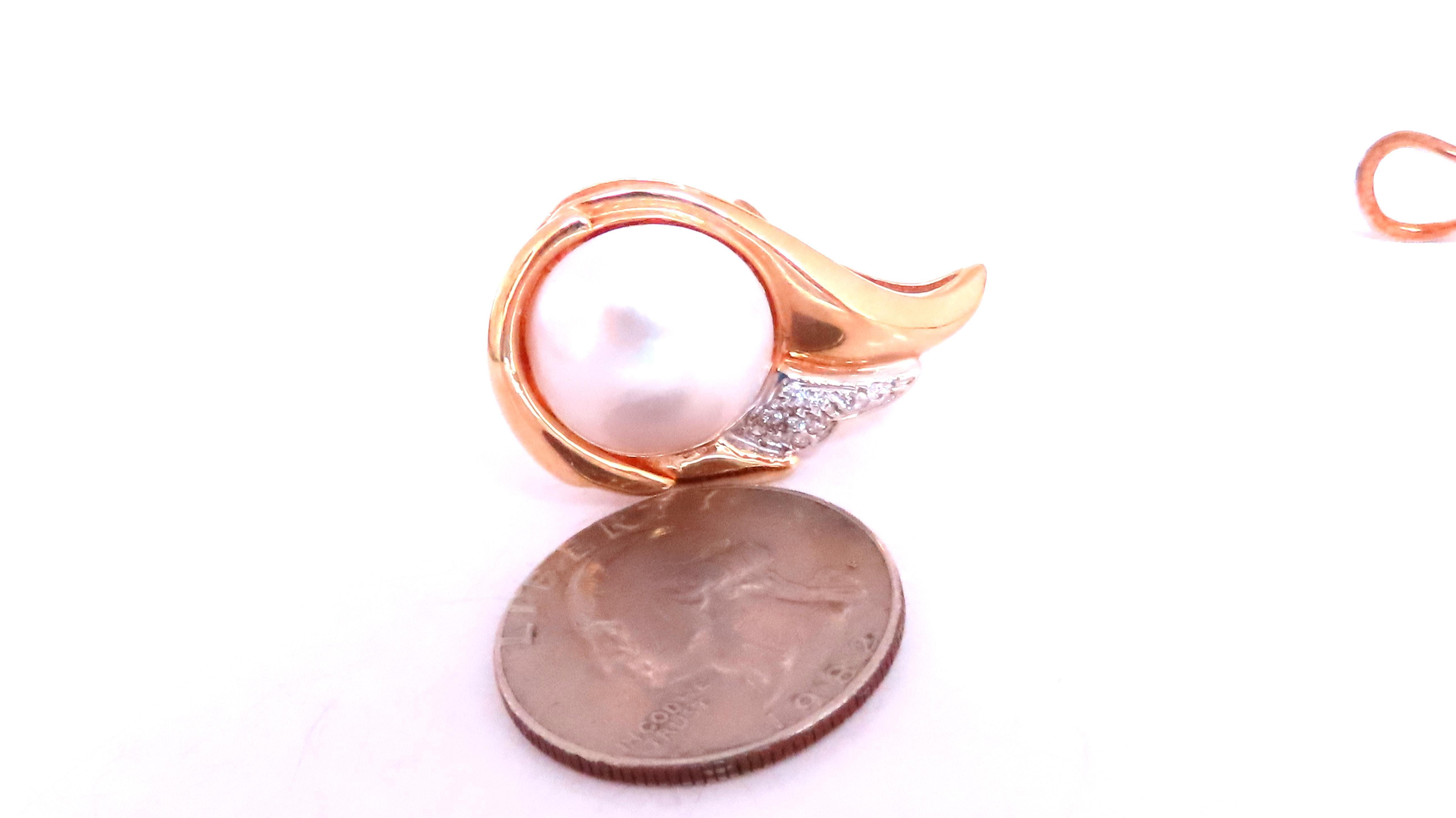 diamonds pearl clip earrings 
14mm mabe pearl
16ct natural round diamonds 
h-color vs-2 clarity
14kt yellow gold 18.2 grams 
earrings: 31 x 20mm 
comfortable omega clips