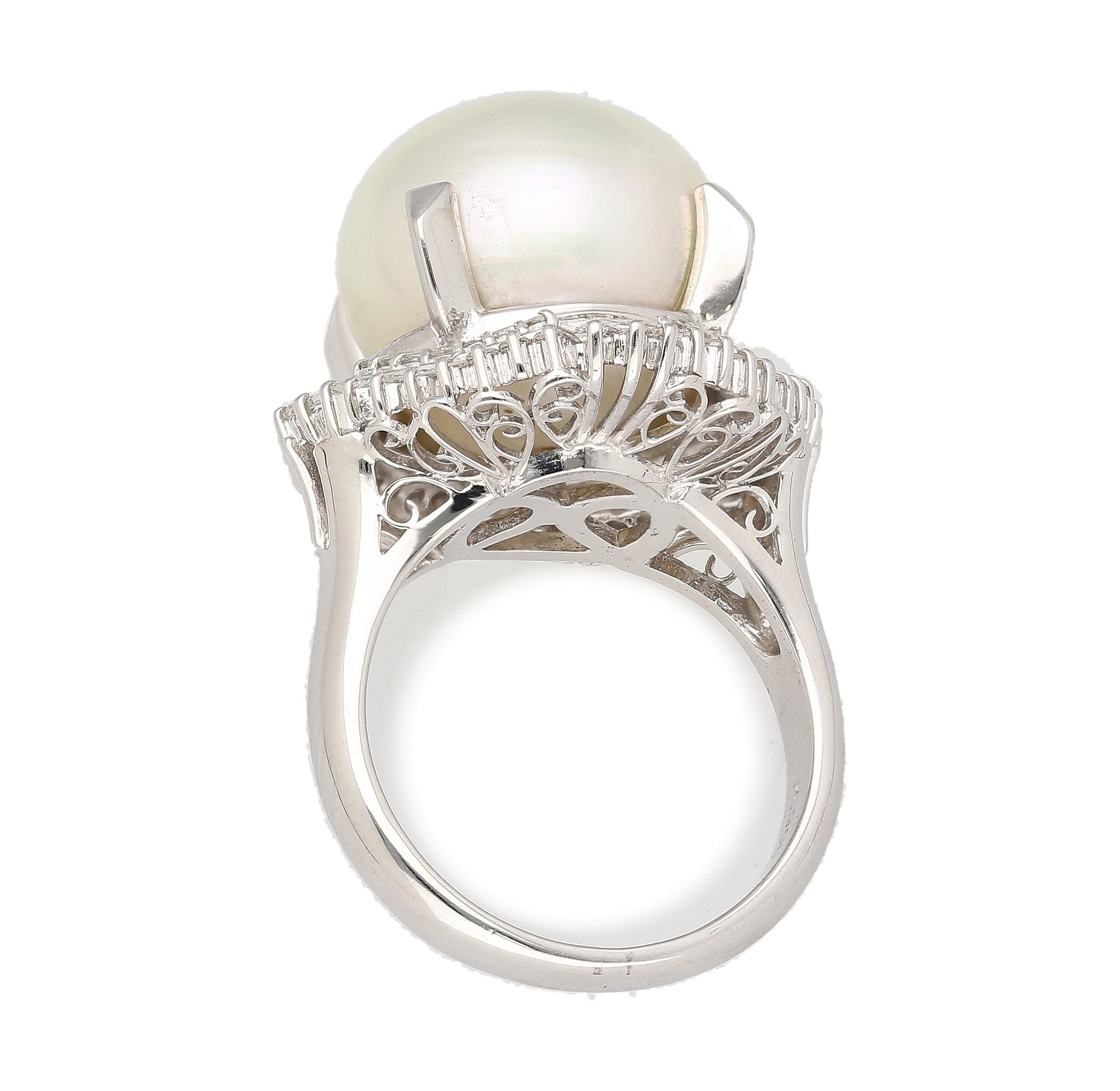 14mm cultured white pearl, beautifully accented by 0.84 carats of baguette and round-cut diamonds, set in Platinum 900 cocktail ring.
 
Details: 
Item Type: Women's Cocktail Ring
Metal: Platinum 900
Weight: 13.36 Grams
Ring Size: 7