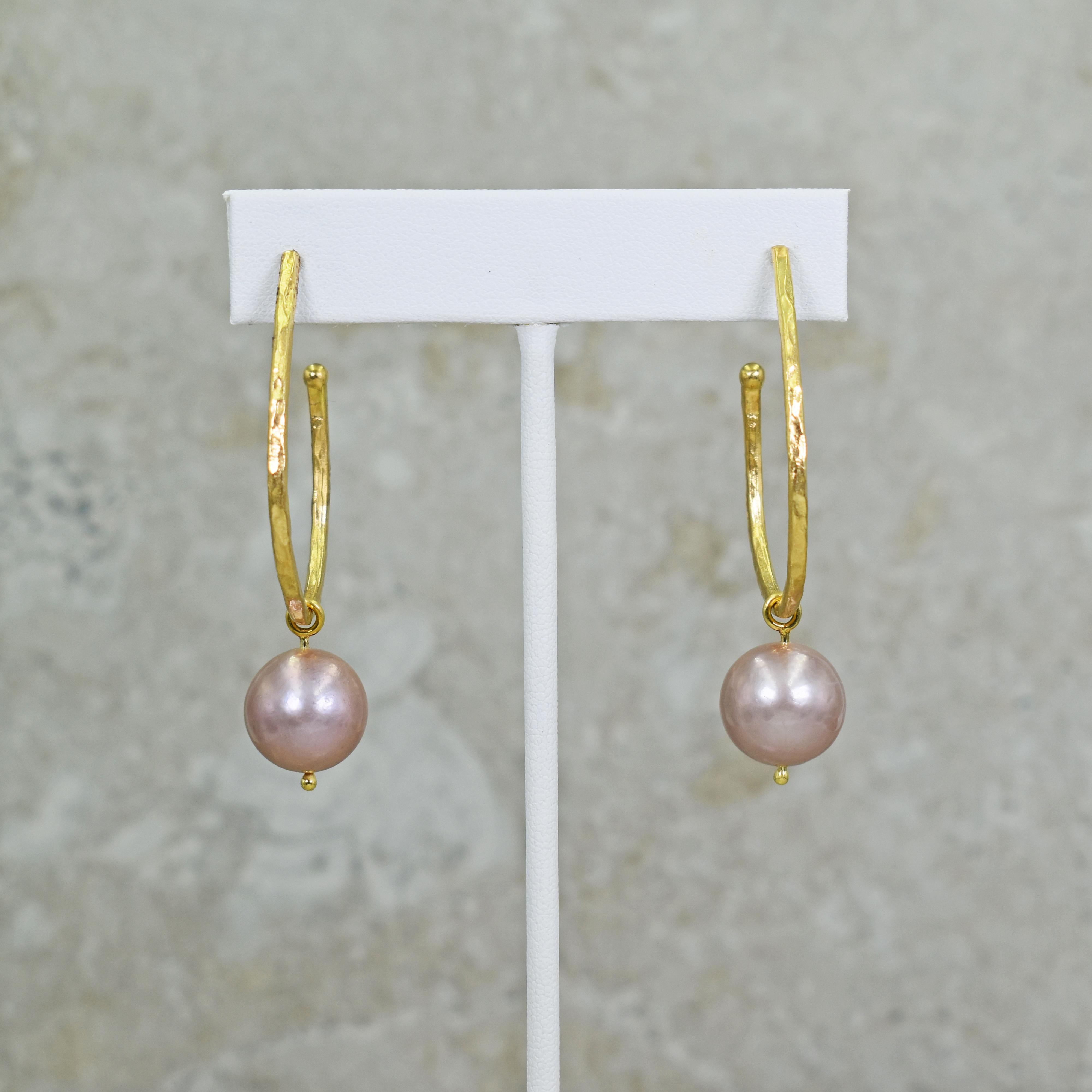 Hammered 18k yellow gold elongated hoop stud earrings with 14mm Pink Freshwater Pearl charms. Hoop earrings are 1.63 inches in length, and with pearl charms, earrings are 2.25 inches in total length. Charms can be removed so the hoops can be worn