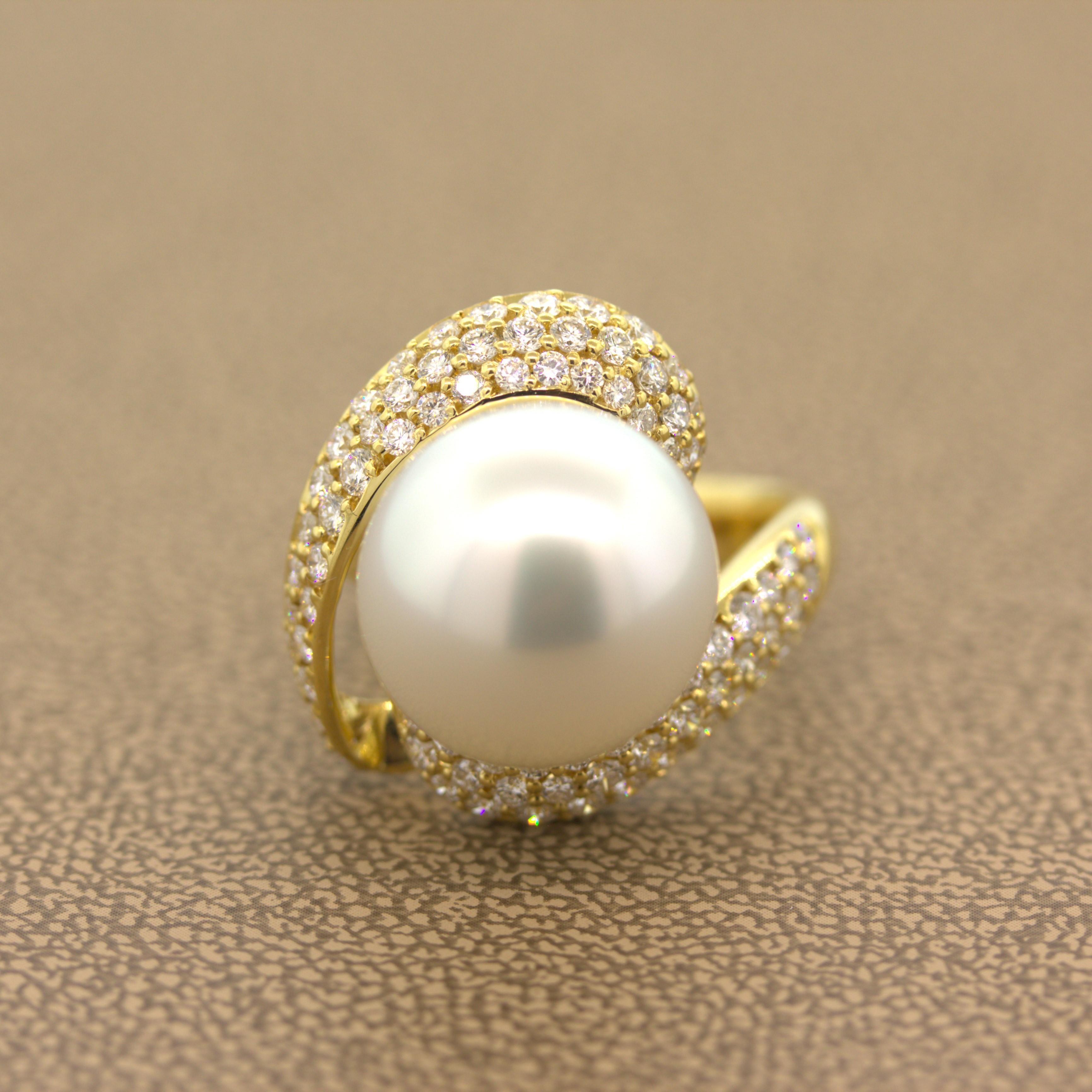 A lovely piece featuring a fine 14mm South Sea pearl. The pearl has a clean white color with excellent luster and nacre quality. Adding to that, the pearl is rounded with no blemishes or imperfections. It is complemented by 1.50 carats of round