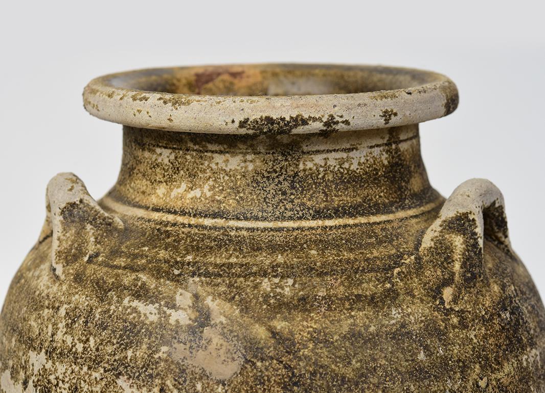 Antique Thai Sukhothai pottery jar.

Age: Thailand, Sukhothai Period, 14th - 16th Century
Size: Height 25.2 C.M. / Width 17 C.M.
Condition: Nice condition overall (some expected degradation due to its age).

100% Satisfaction and authenticity