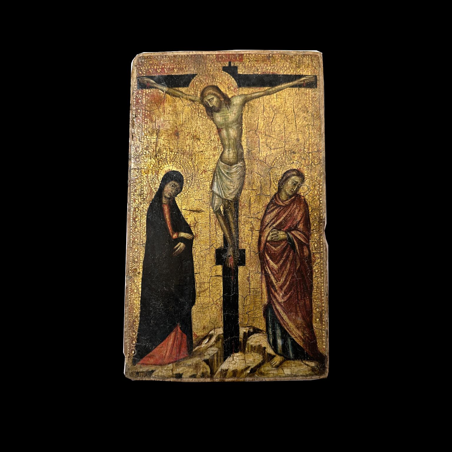 This splendid wooden plaque with a golden Tuscan background and dating back to the Late Middle Ages is attributed to a Sienese master active around the 14th century. Painted on an engraved gold background, the plaque depicts the crucifixion of