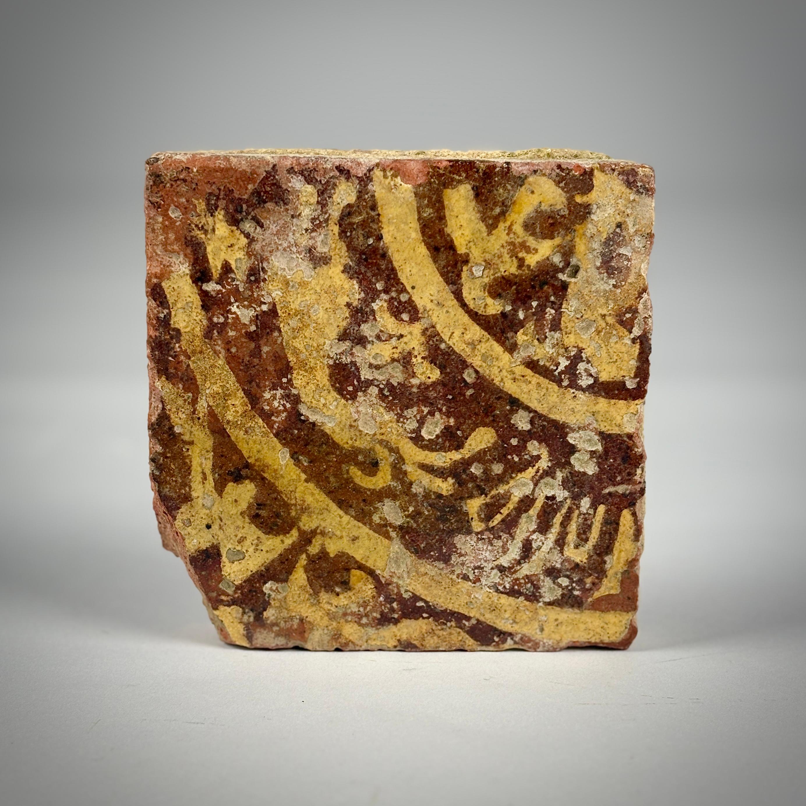 Encaustic Medieval Floor Tile, with impressed and inlaid slip filled decoration.

14th Century, wear and condition commensurate with age, minor loss to one corner.