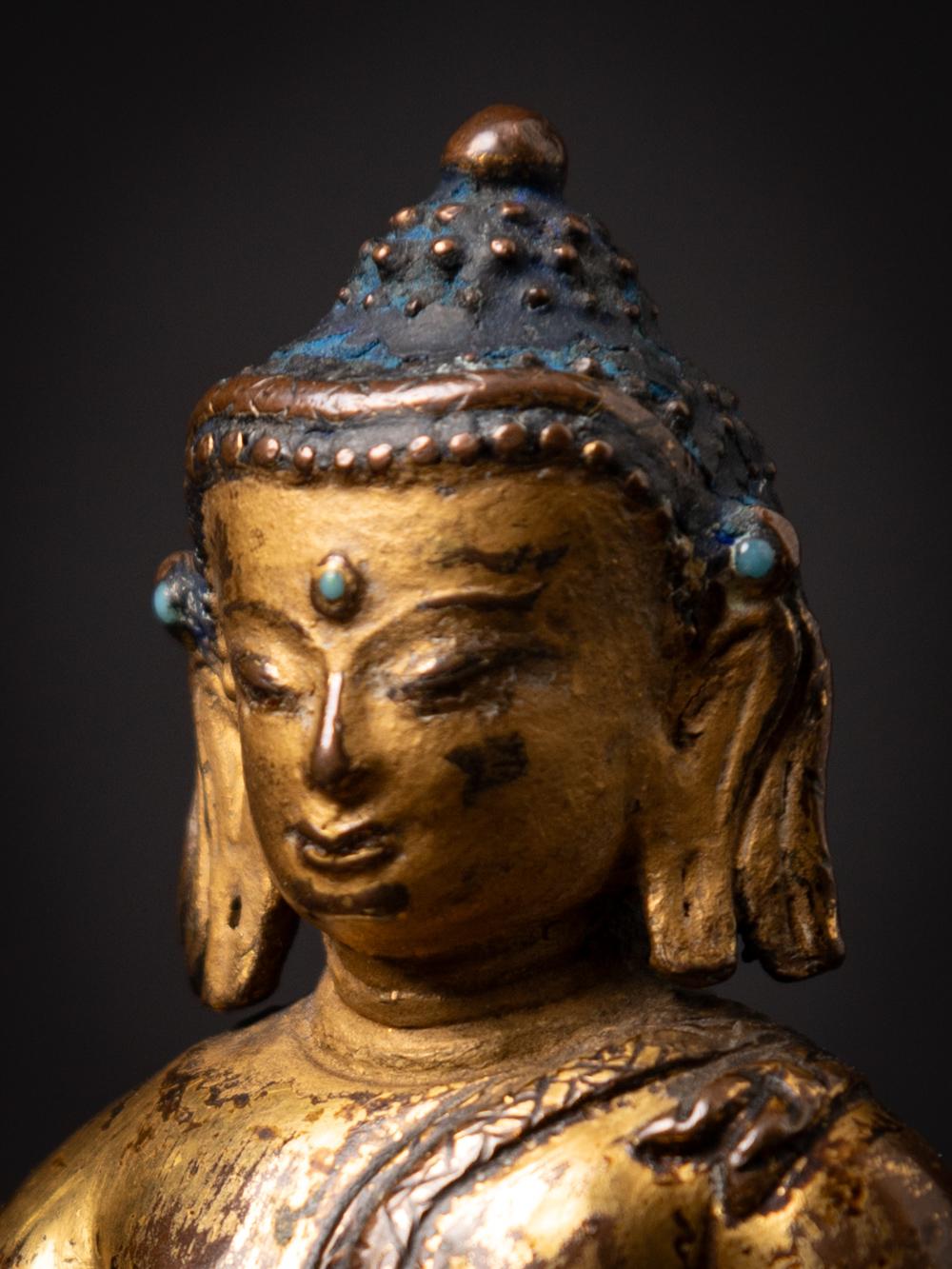 Bronze 14th century Tibetan gilt and lacquered Śākyamuni Buddha in Bhumisparsha Mudra For Sale