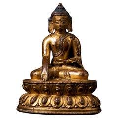 Bouddha tibétain doré et laqué Śākyamuni du XIVe siècle en Bhumisparsha Mudra